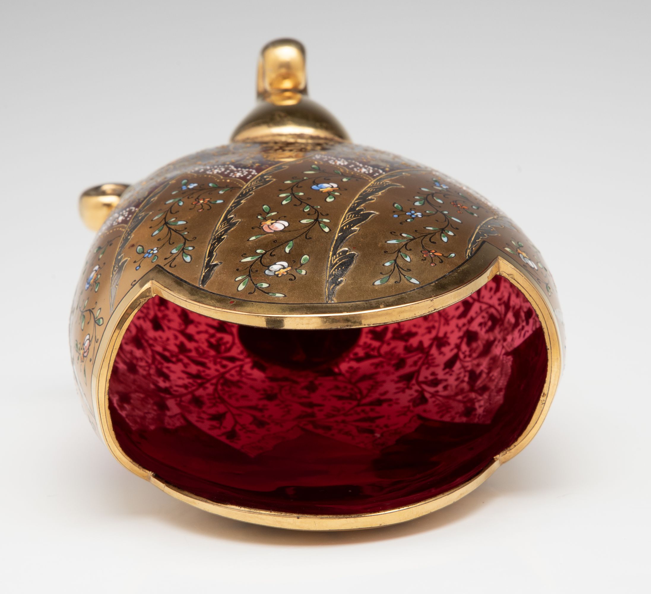 A VERY FINE MOSER GILT AND ENAMEL DEEP RUBY PILLOW VASE