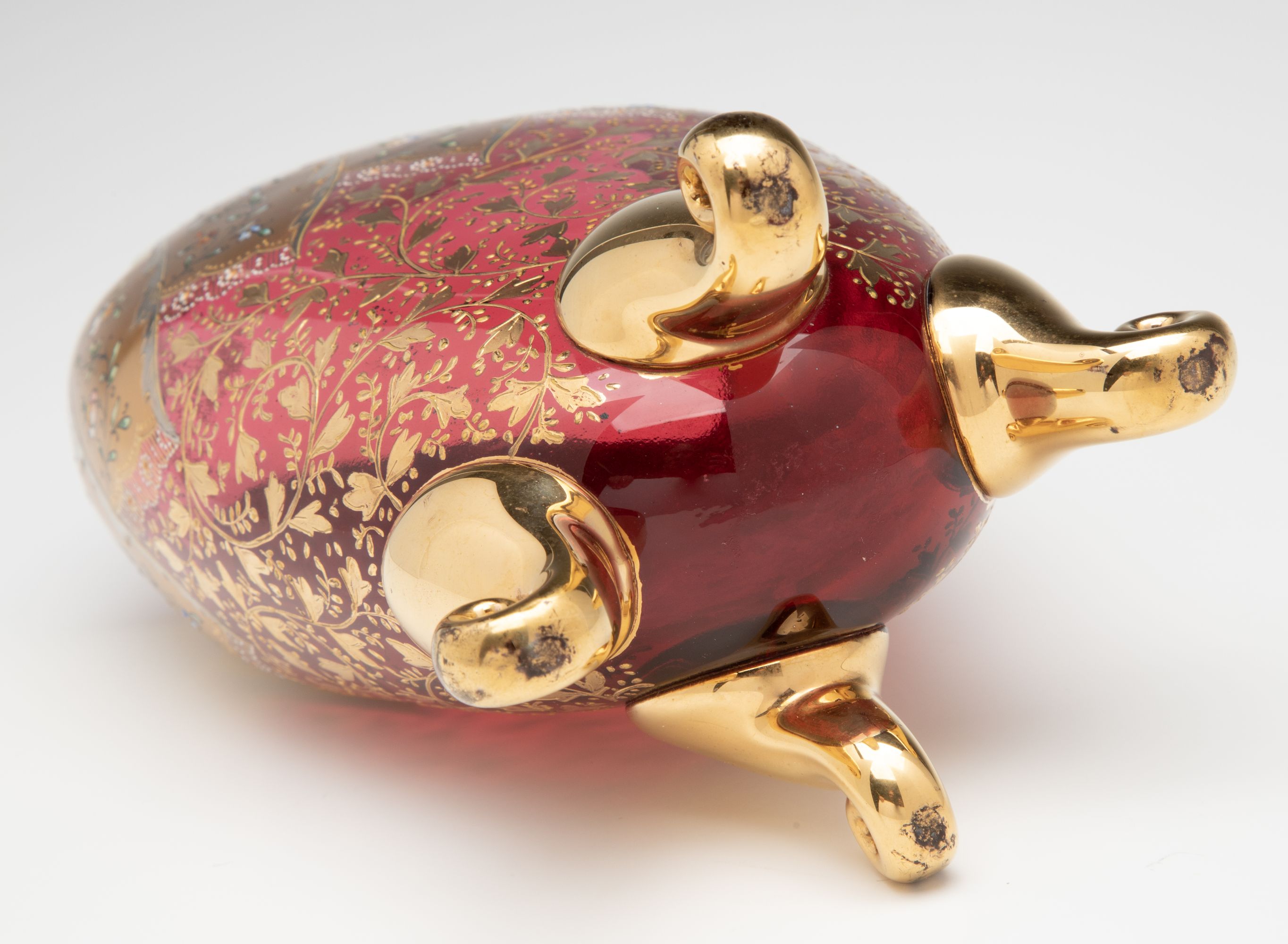 A VERY FINE MOSER GILT AND ENAMEL DEEP RUBY PILLOW VASE