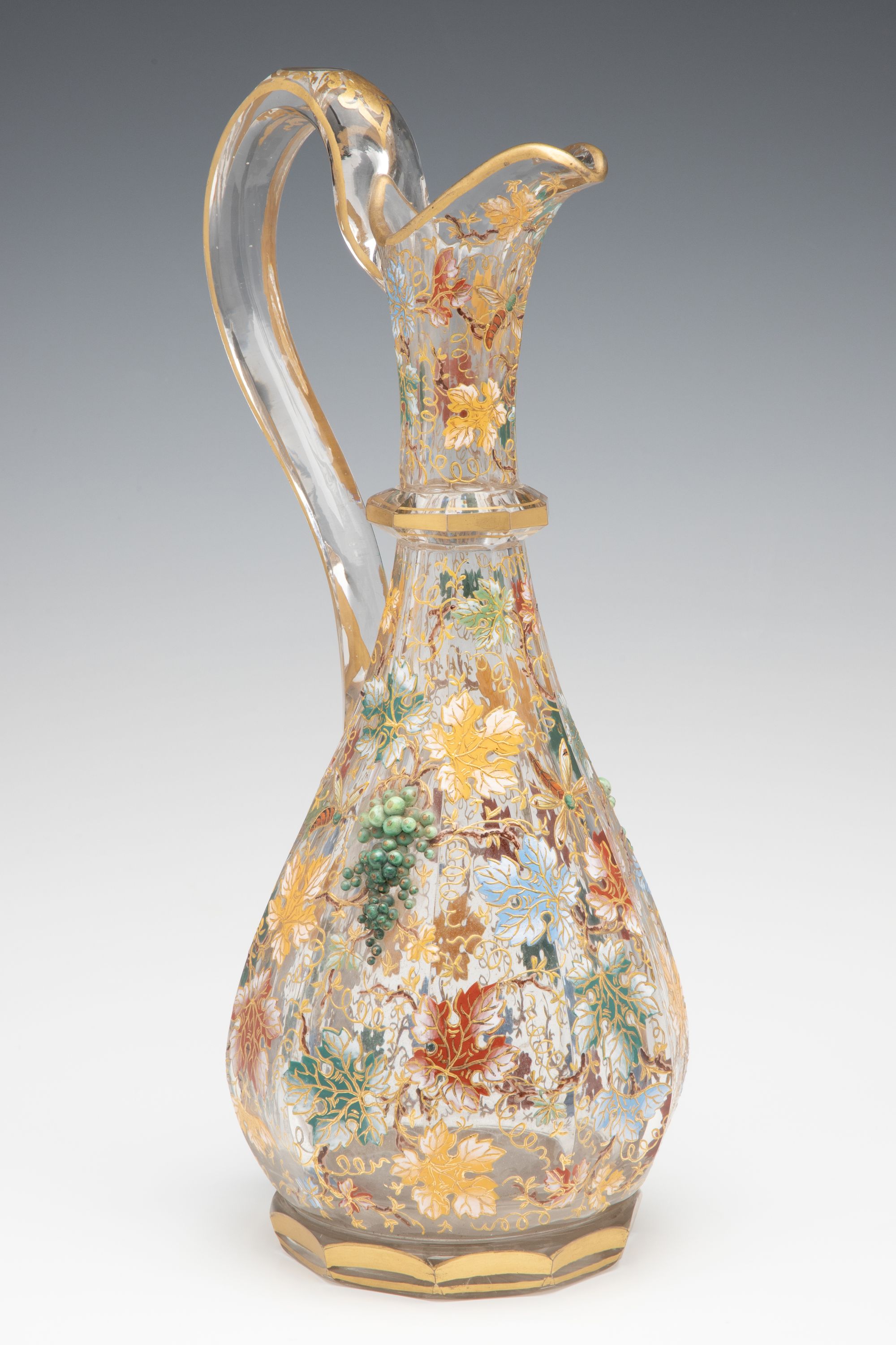 A MOSER CUT AND ENAMEL CRYSTAL EWER WITH APPLIED GRAPES