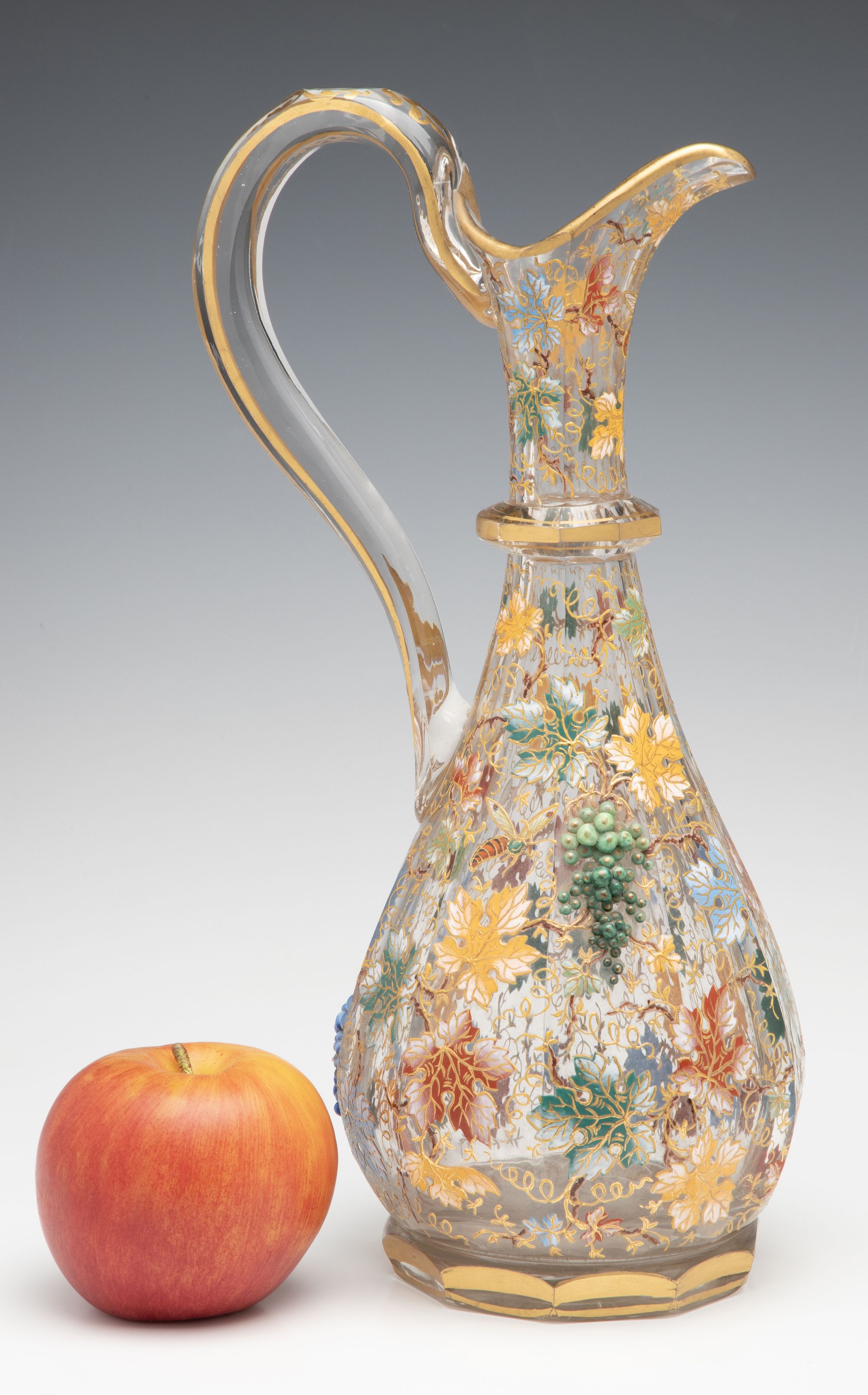 A MOSER CUT AND ENAMEL CRYSTAL EWER WITH APPLIED GRAPES