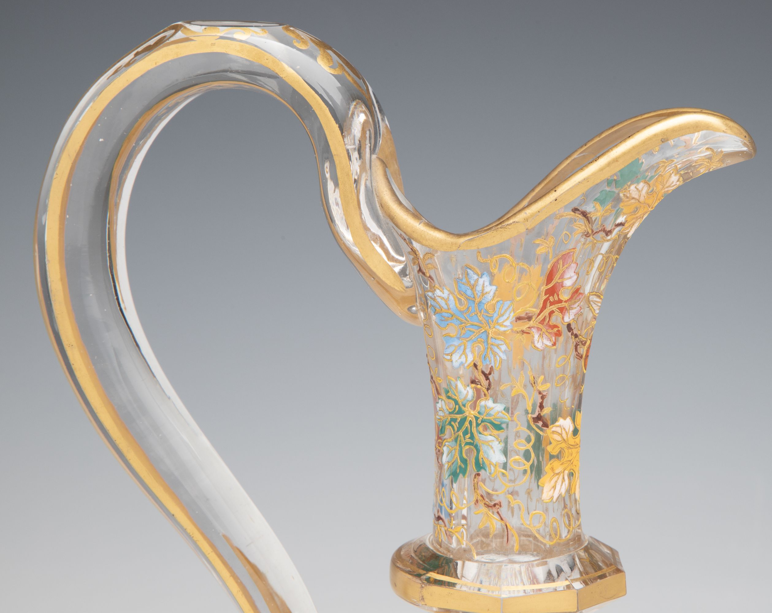 A MOSER CUT AND ENAMEL CRYSTAL EWER WITH APPLIED GRAPES