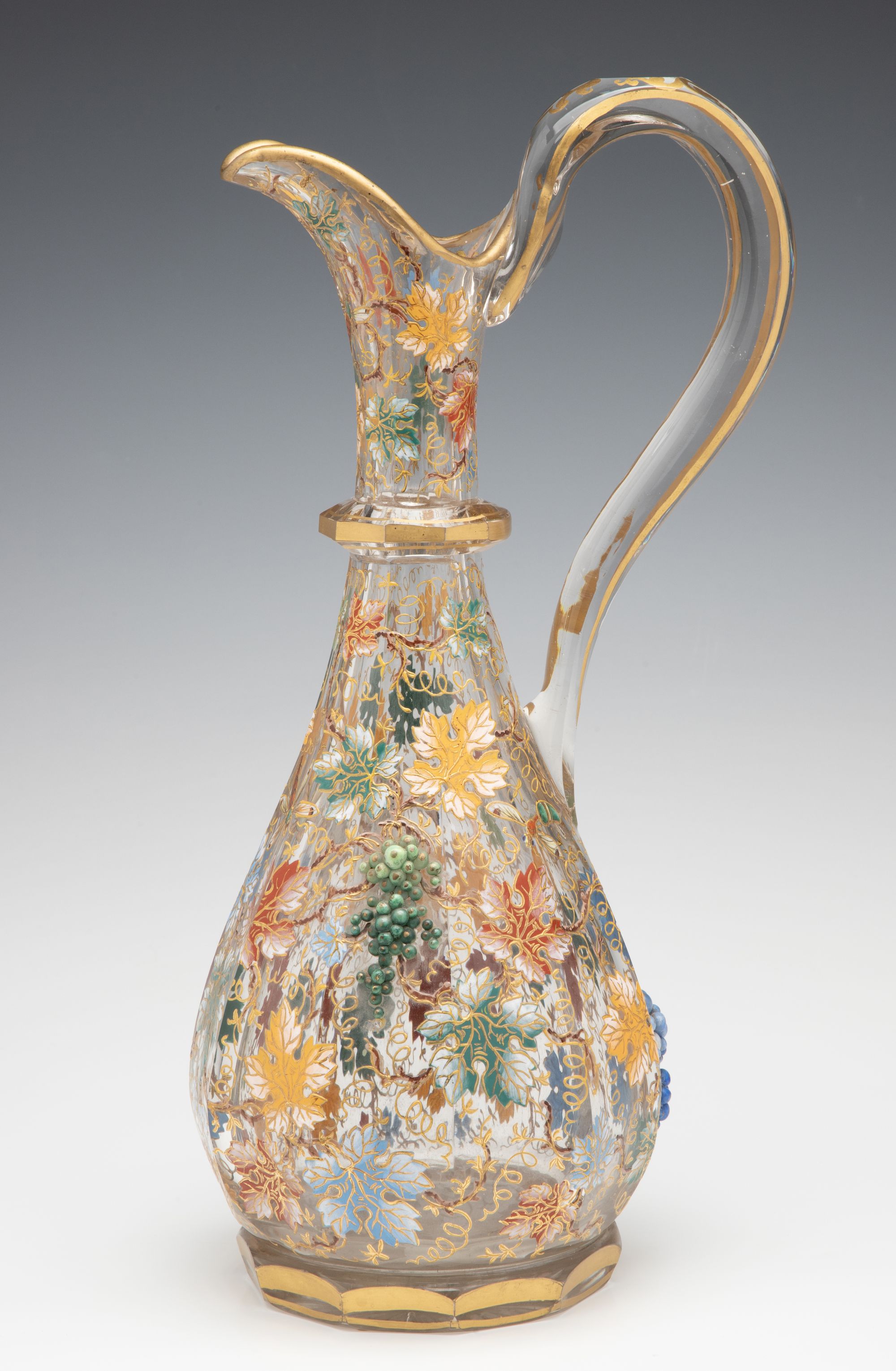 A MOSER CUT AND ENAMEL CRYSTAL EWER WITH APPLIED GRAPES