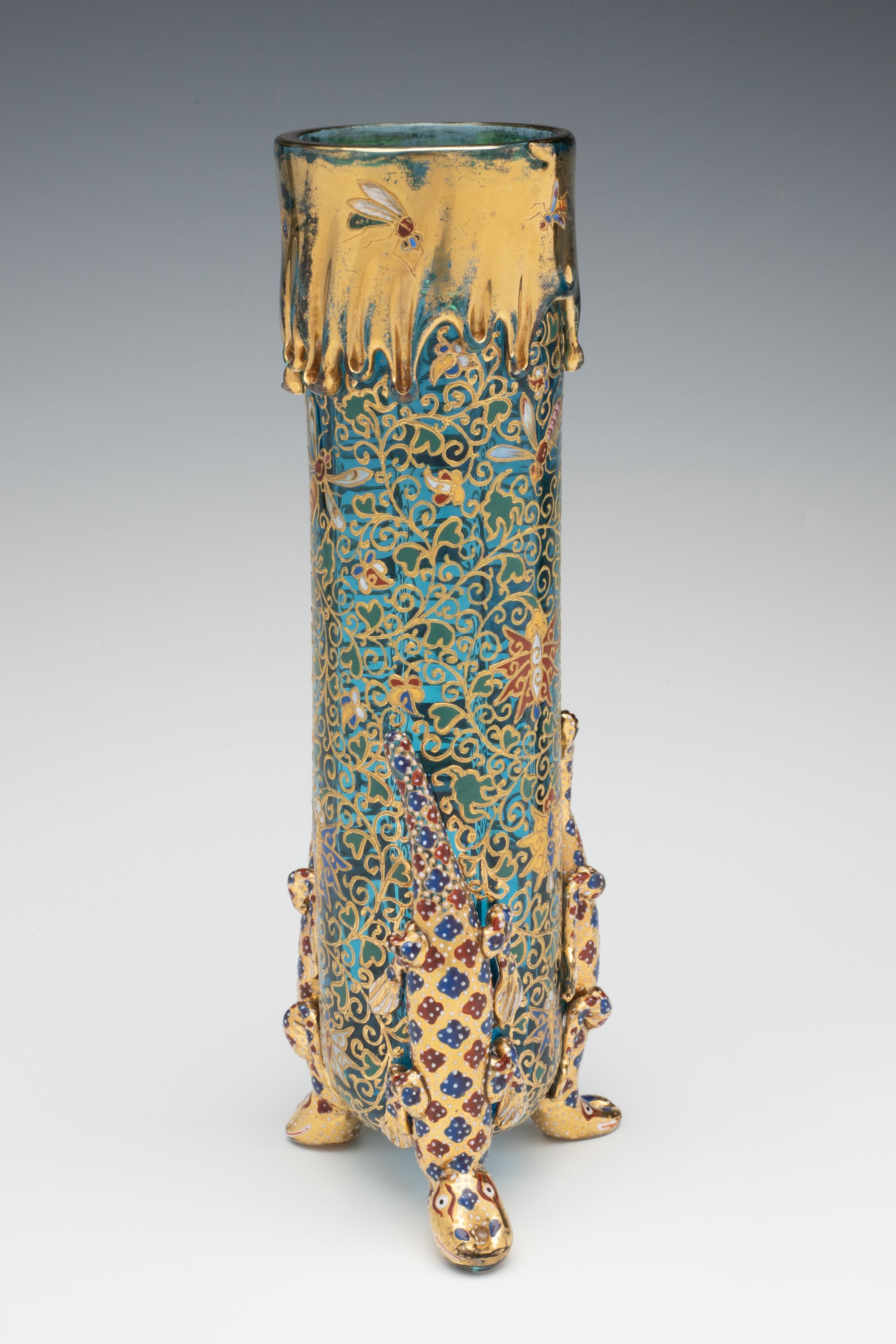 A MOSER BLUE CRYSTAL VASE ON FIGURAL LIZARD SUPPORTS