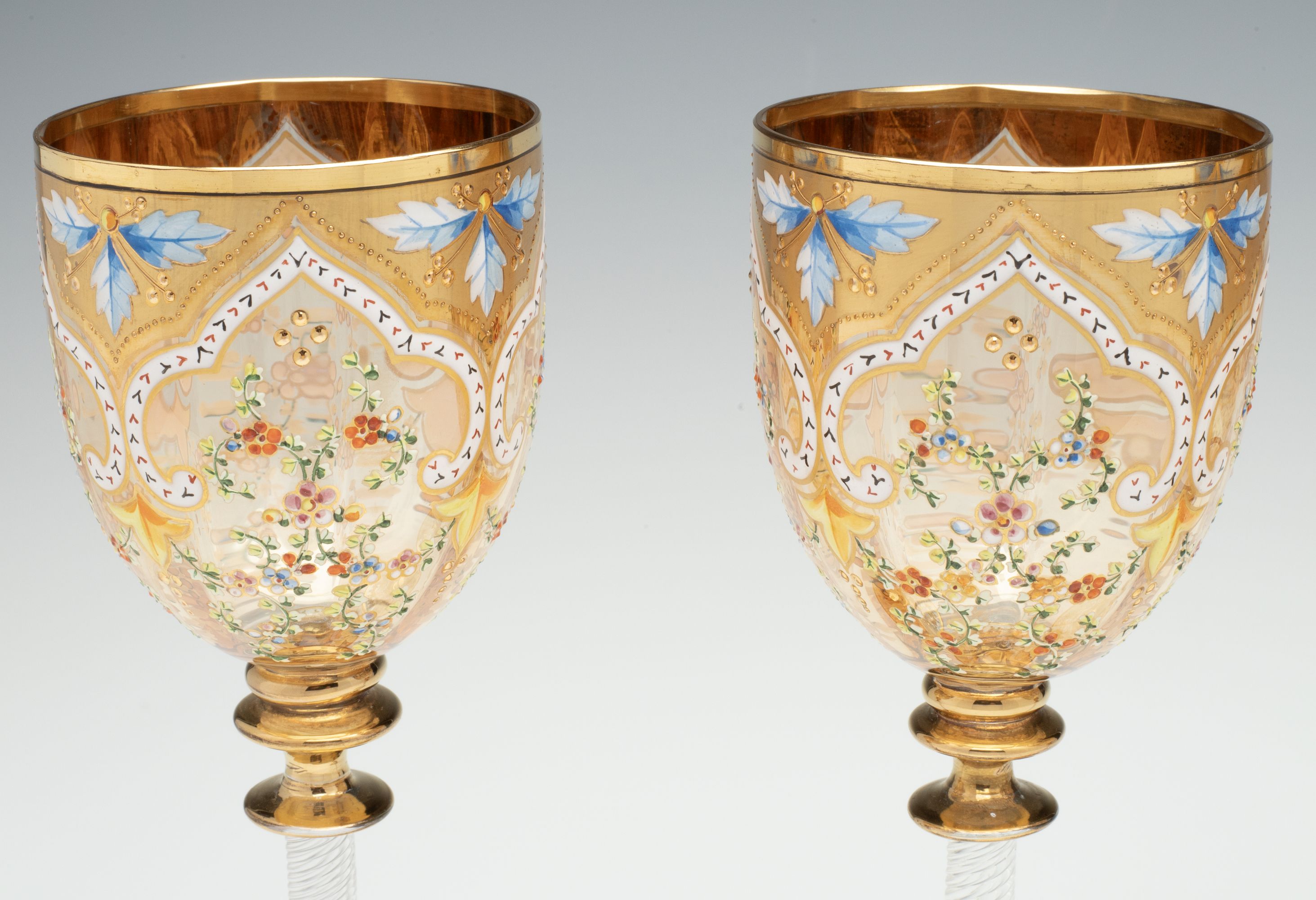 MOSER GILT AND ENAMEL WINES WITH FINE ROPE TWIST STEMS