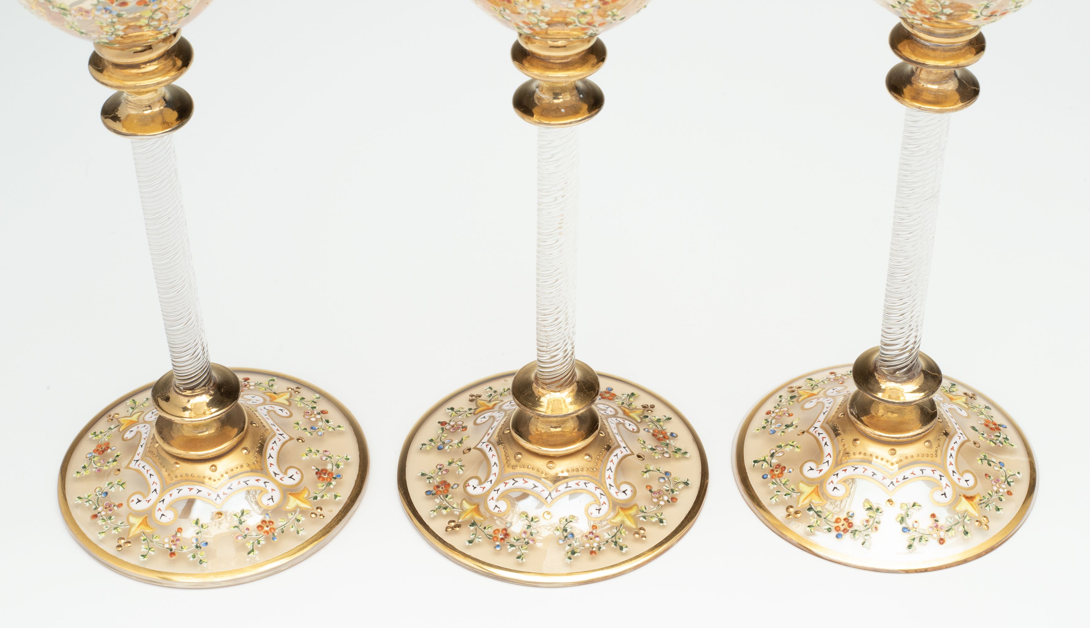 MOSER GILT AND ENAMEL WINES WITH FINE ROPE TWIST STEMS