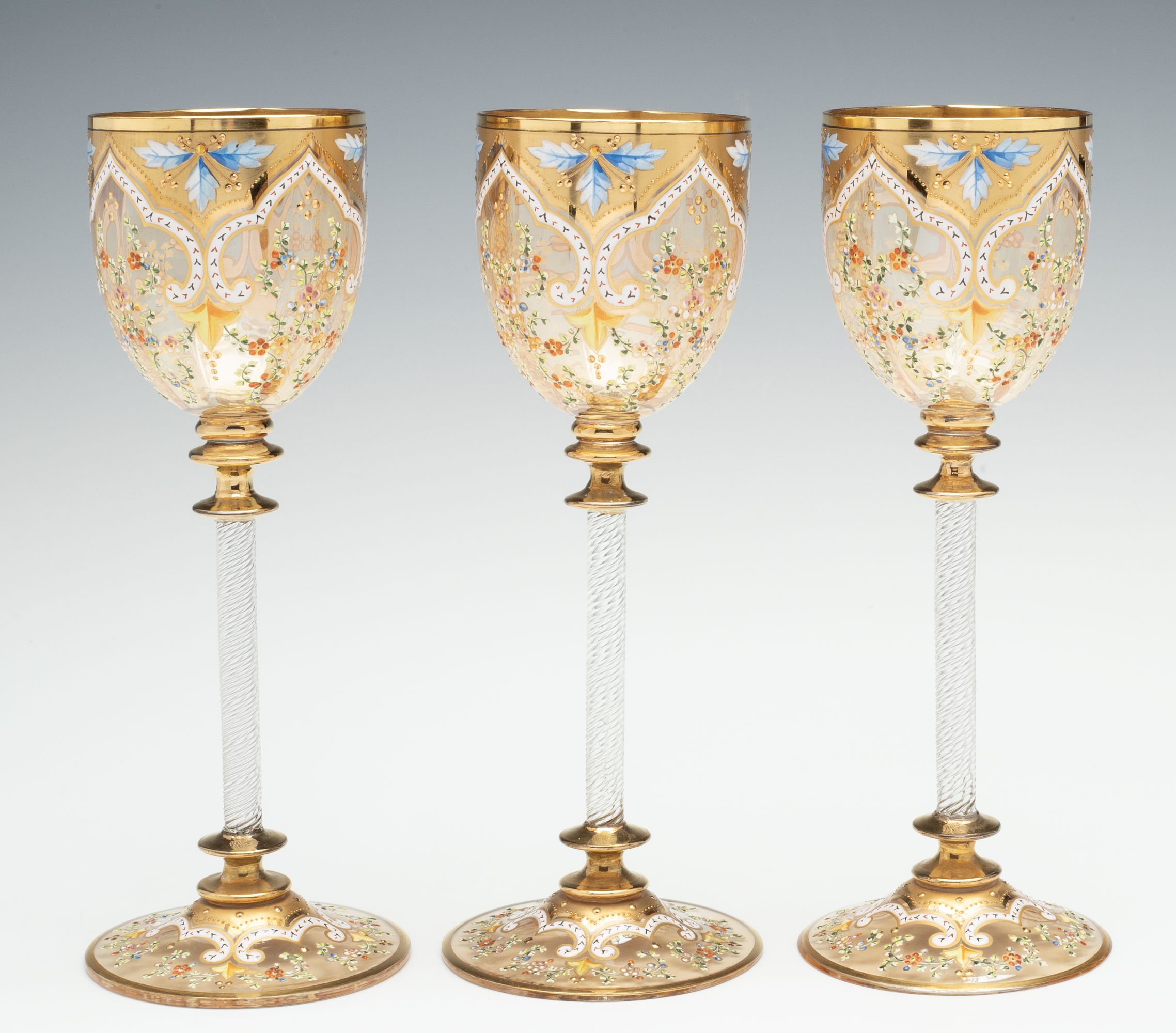 MOSER GILT AND ENAMEL WINES WITH FINE ROPE TWIST STEMS