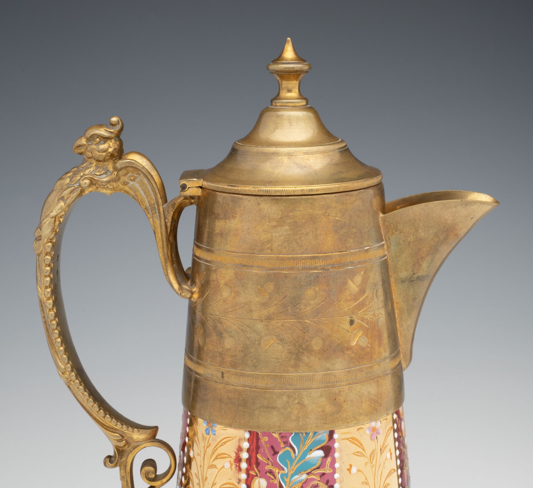 A MOSER GILT AND ENAMEL JUG WITH BRASS MOUNTS