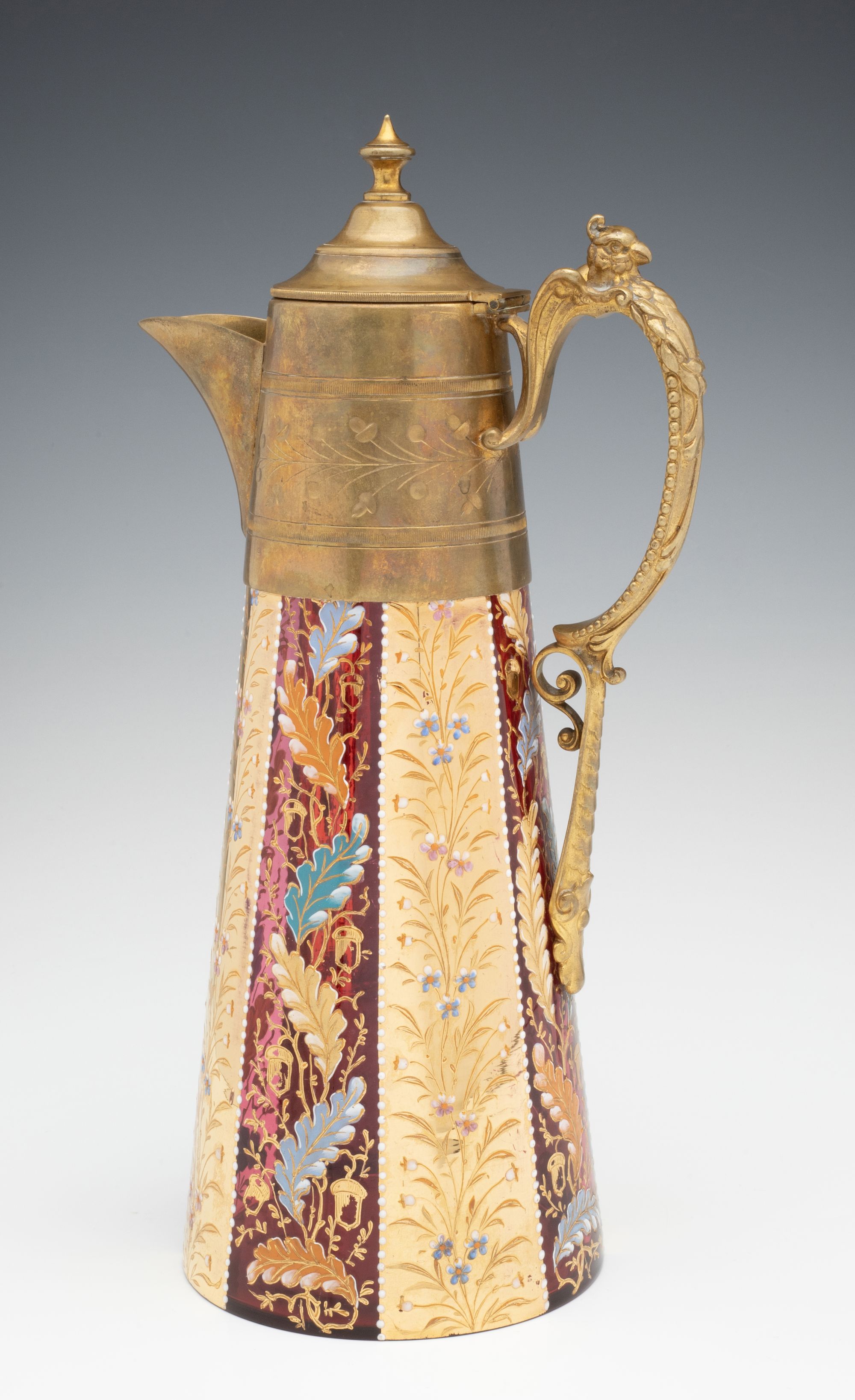 A MOSER GILT AND ENAMEL JUG WITH BRASS MOUNTS