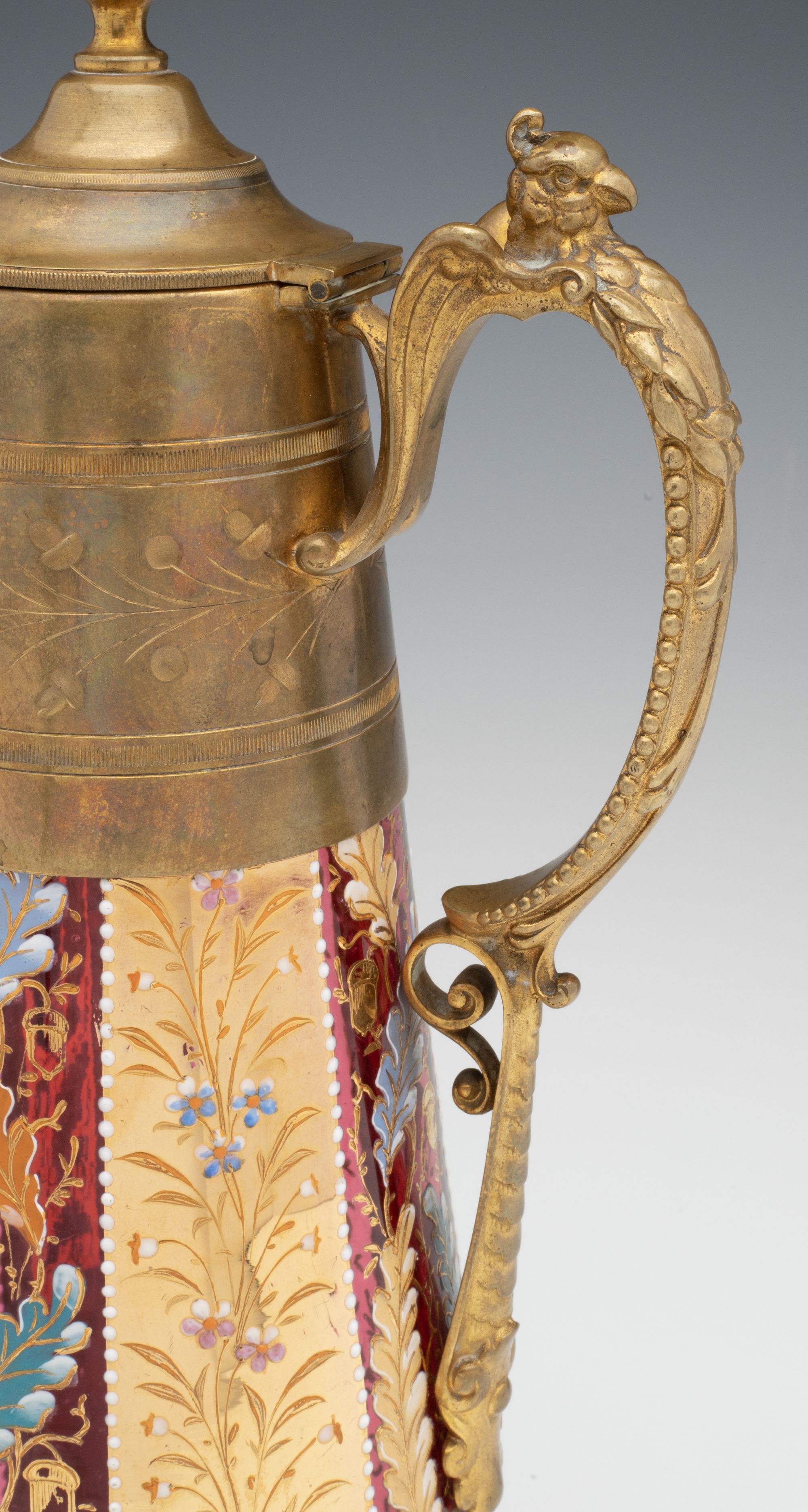 A MOSER GILT AND ENAMEL JUG WITH BRASS MOUNTS