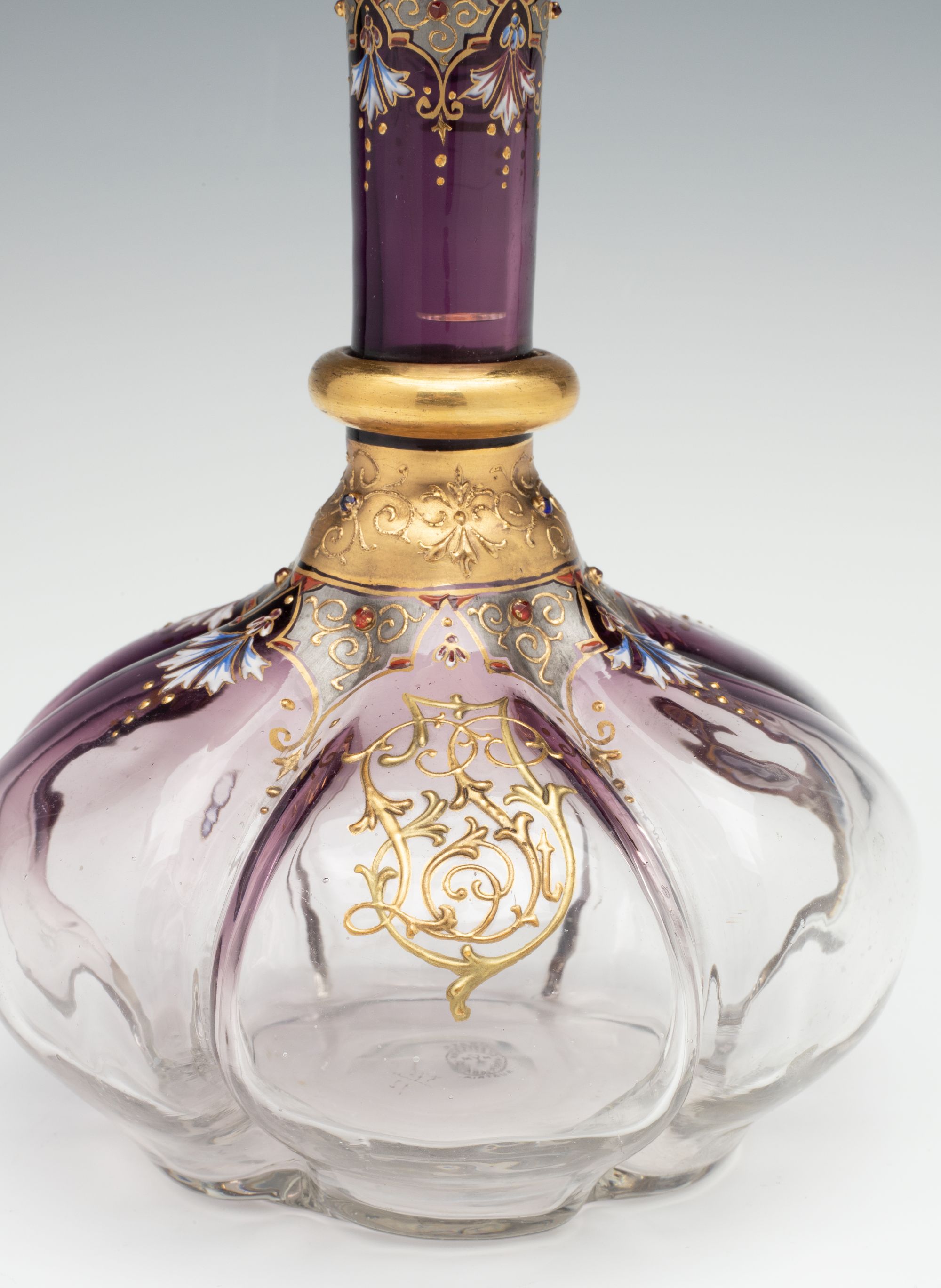 A JEWELED BOHEMIAN GLASS DECANTER AND FOUR STEMS