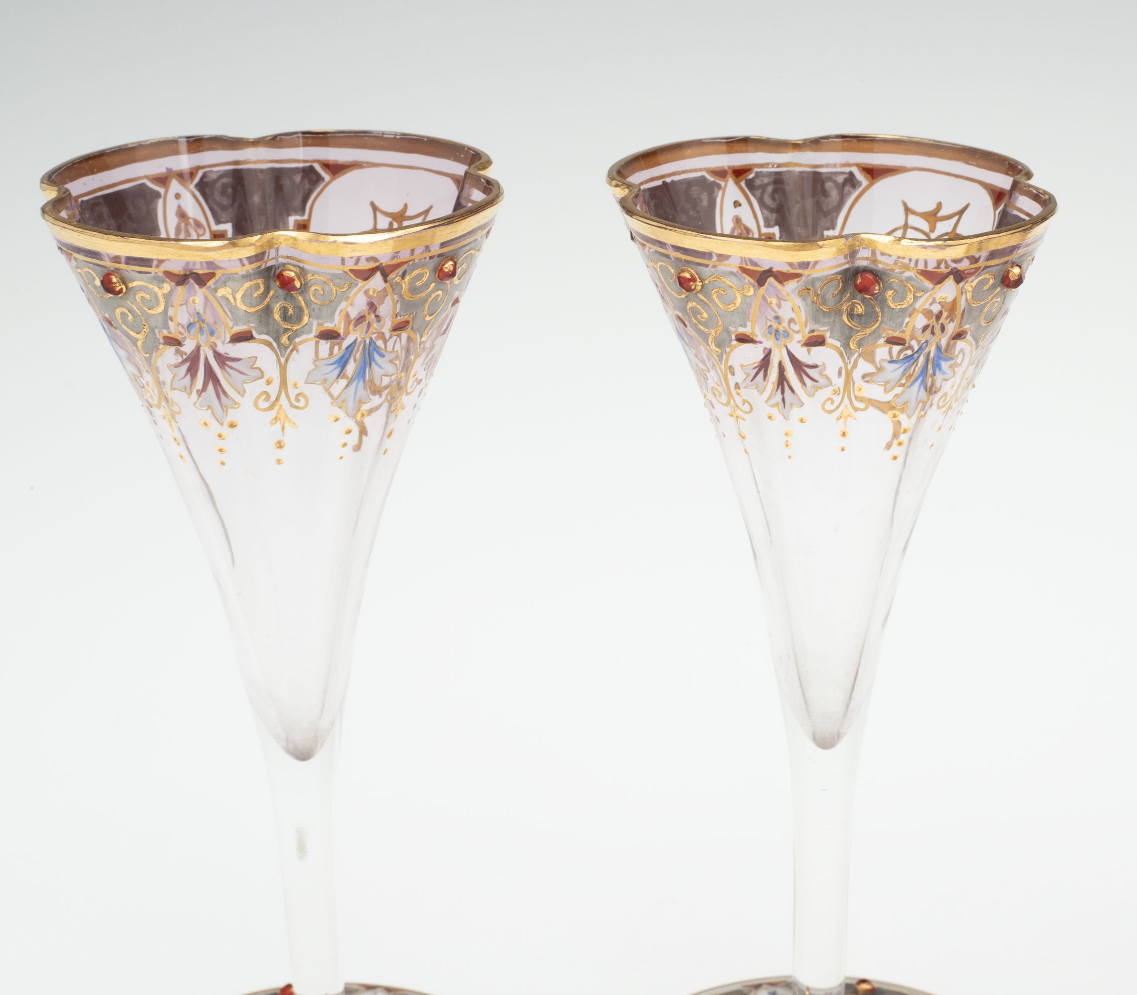 A JEWELED BOHEMIAN GLASS DECANTER AND FOUR STEMS