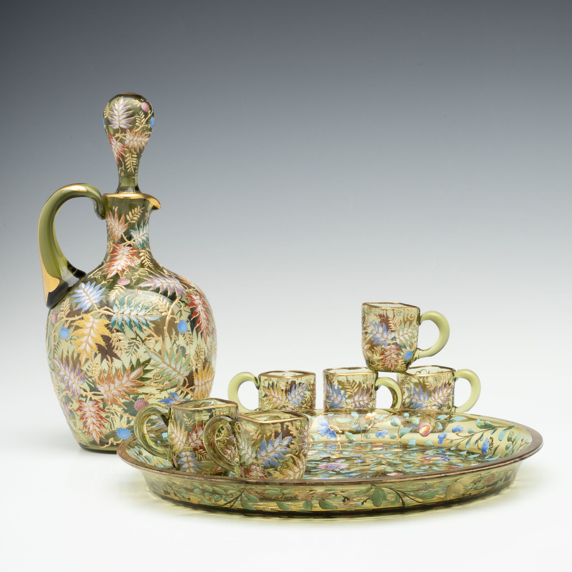 A MOSER GILT AND ENAMEL JUG, TRAY, AND MINIATURE CUPS