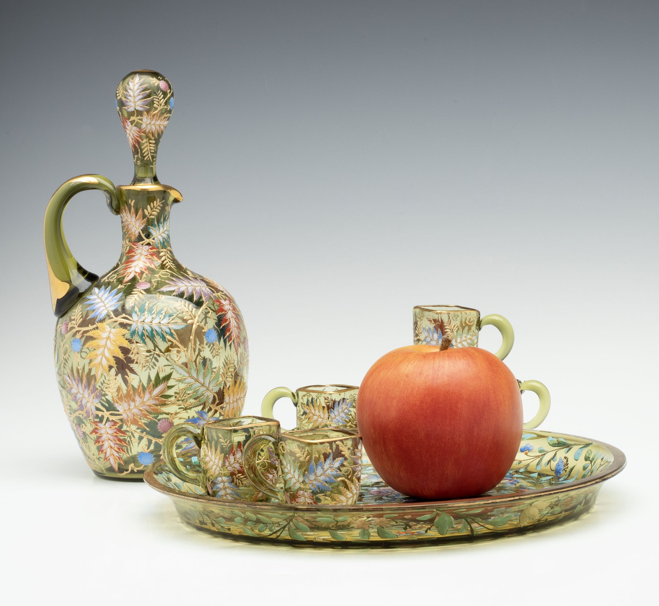 A MOSER GILT AND ENAMEL JUG, TRAY, AND MINIATURE CUPS