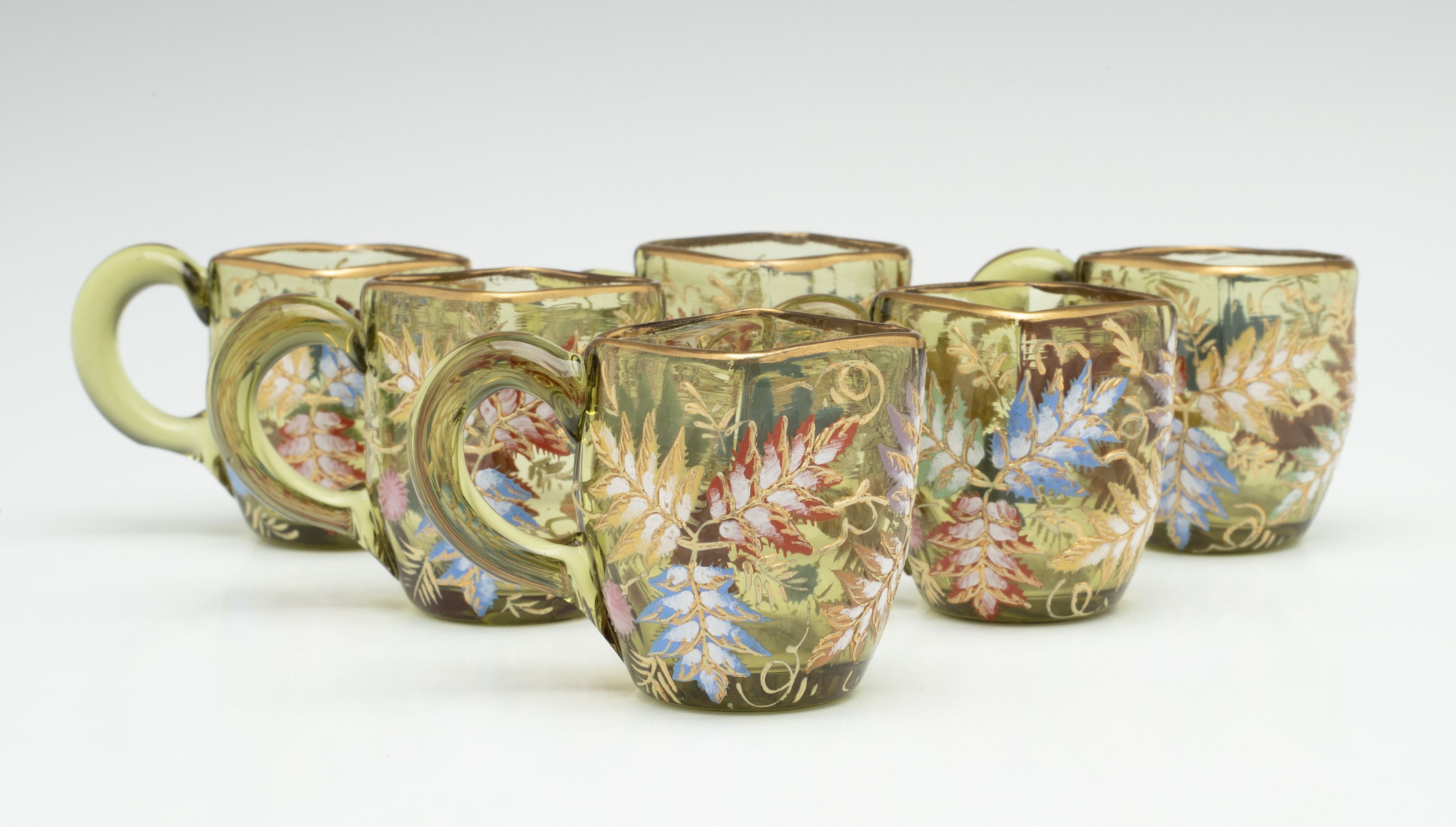 A MOSER GILT AND ENAMEL JUG, TRAY, AND MINIATURE CUPS