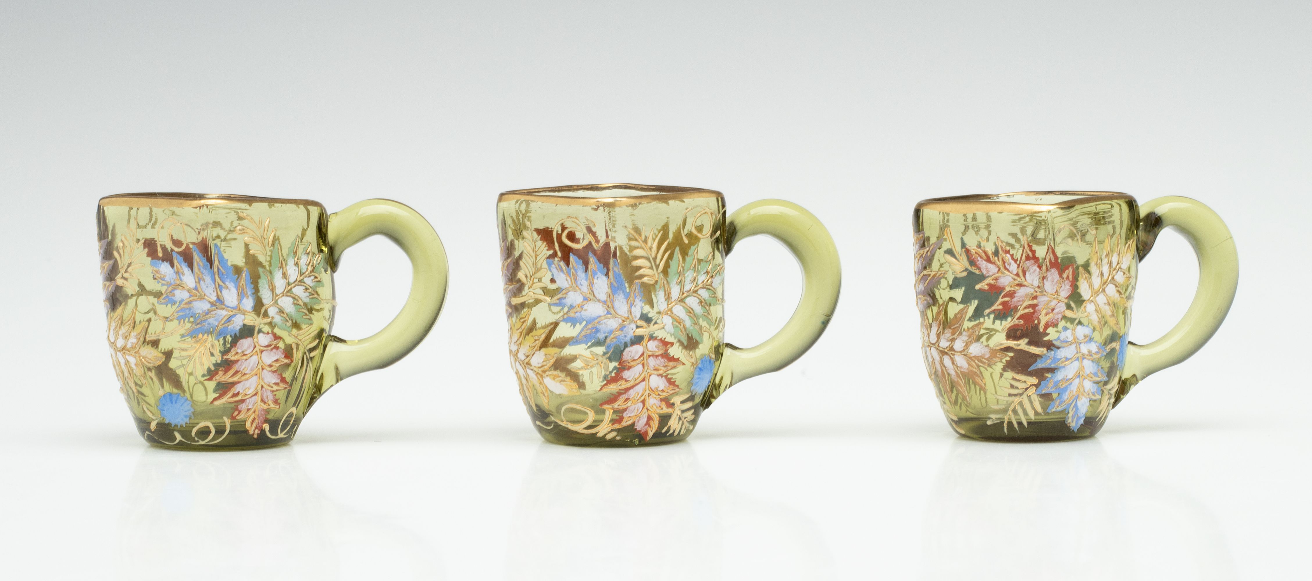 A MOSER GILT AND ENAMEL JUG, TRAY, AND MINIATURE CUPS