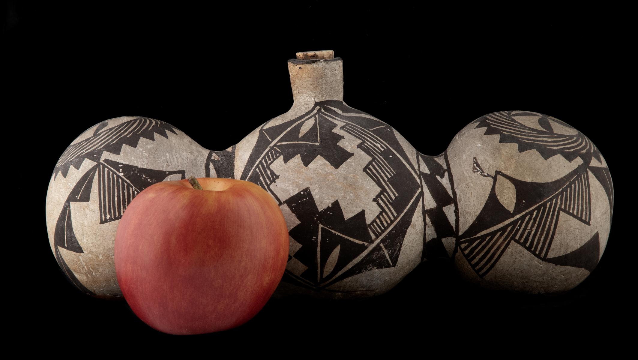A 19TH CENTURY ACOMA TRI-LOBE PUEBLO POTTERY CANTEEN