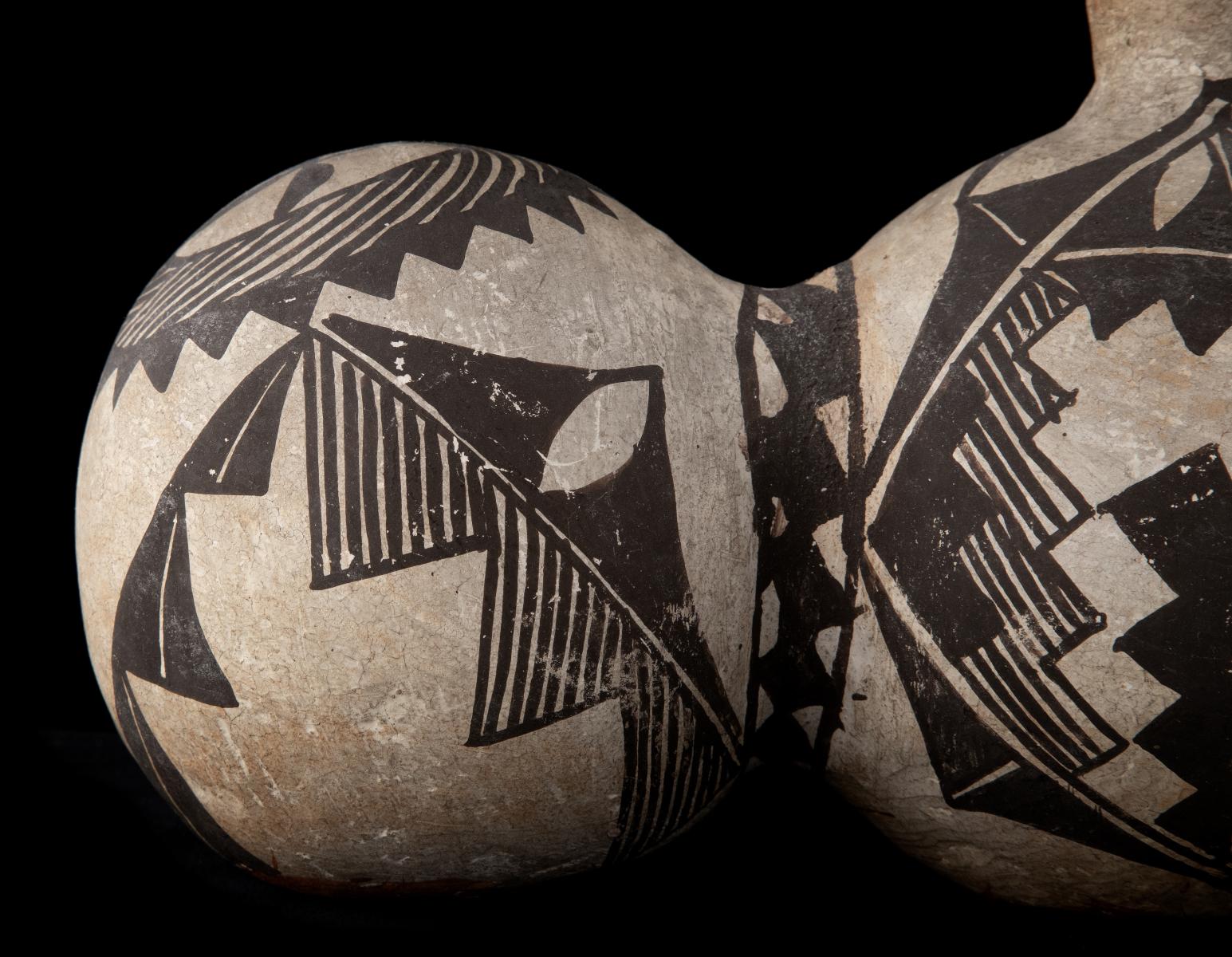 A 19TH CENTURY ACOMA TRI-LOBE PUEBLO POTTERY CANTEEN