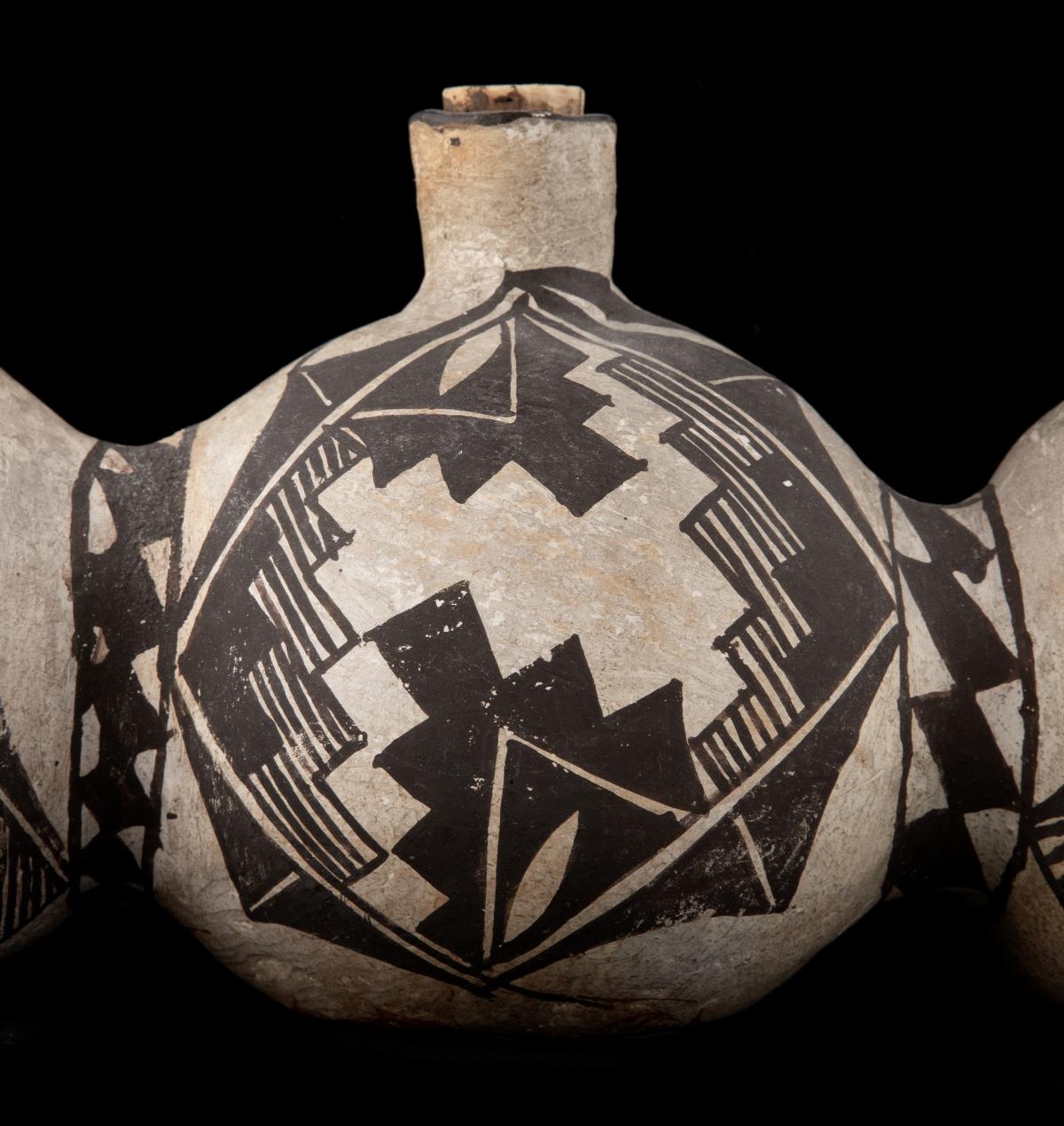 A 19TH CENTURY ACOMA TRI-LOBE PUEBLO POTTERY CANTEEN