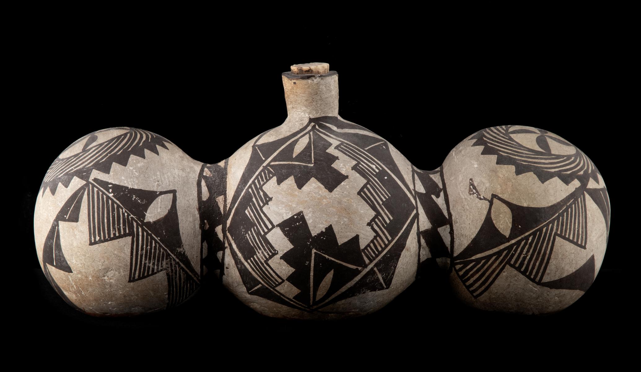 A 19TH CENTURY ACOMA TRI-LOBE PUEBLO POTTERY CANTEEN