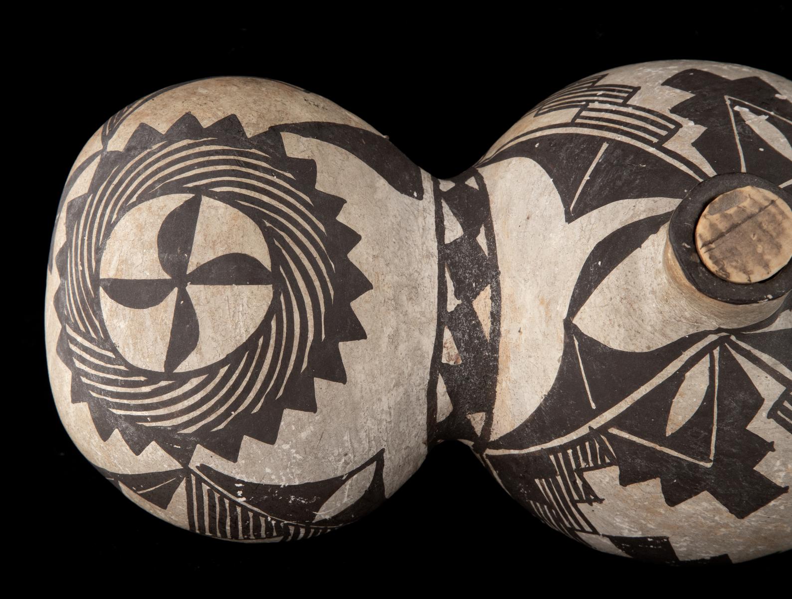 A 19TH CENTURY ACOMA TRI-LOBE PUEBLO POTTERY CANTEEN