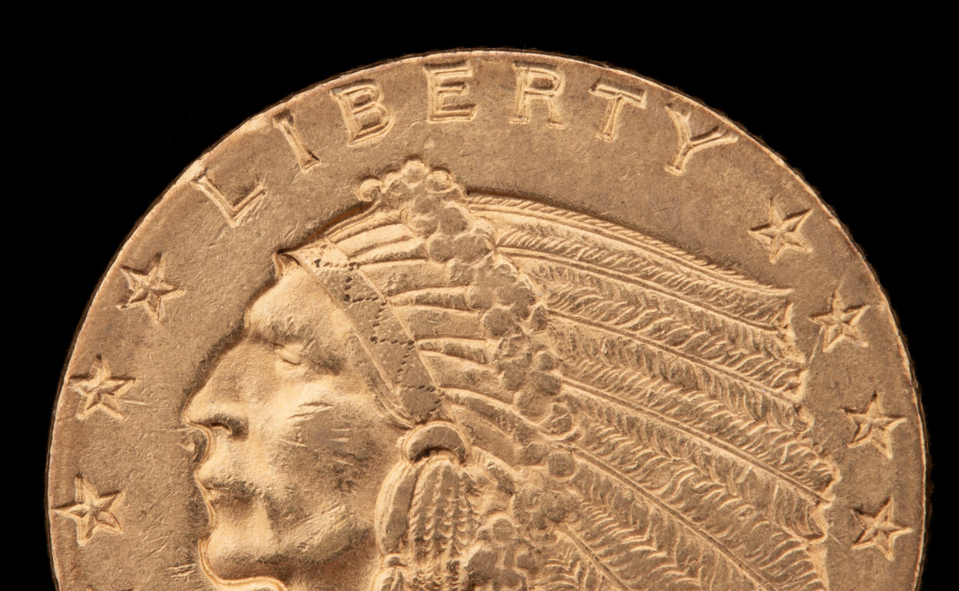 A 1910 $2.50 QUARTER EAGLE GOLD COIN