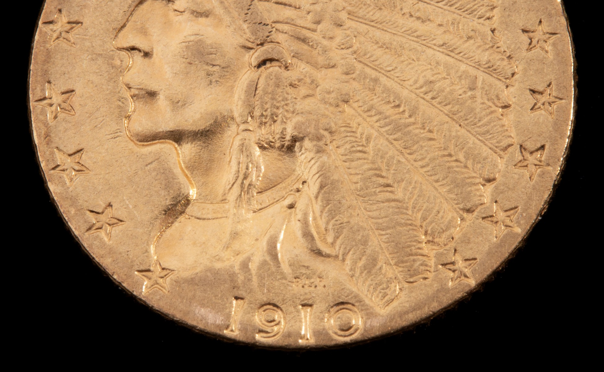 A 1910 $2.50 QUARTER EAGLE GOLD COIN