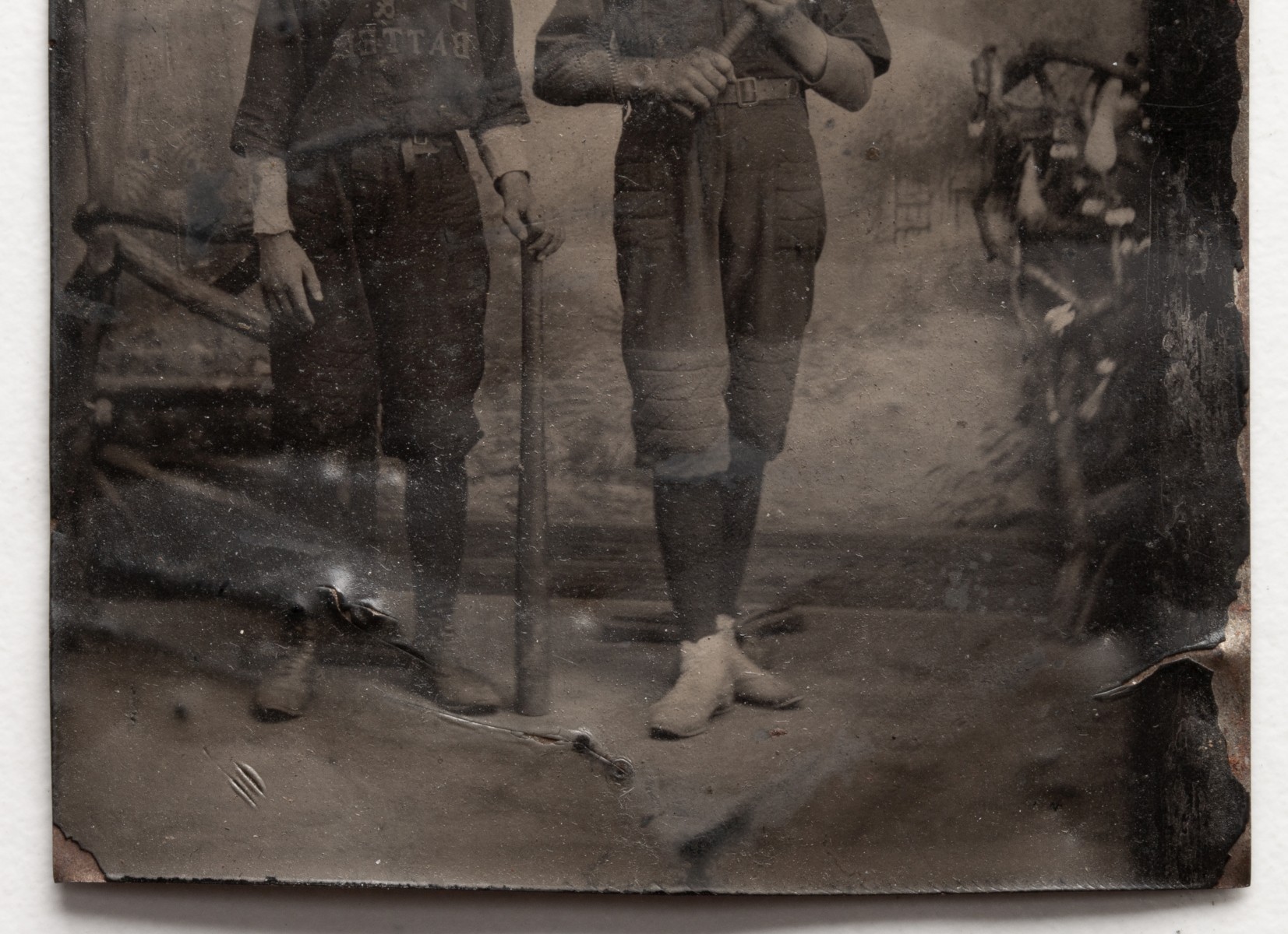 A QUARTER PLATE TINTYPE PORTRAIT OF BASEBALL PLAYERS