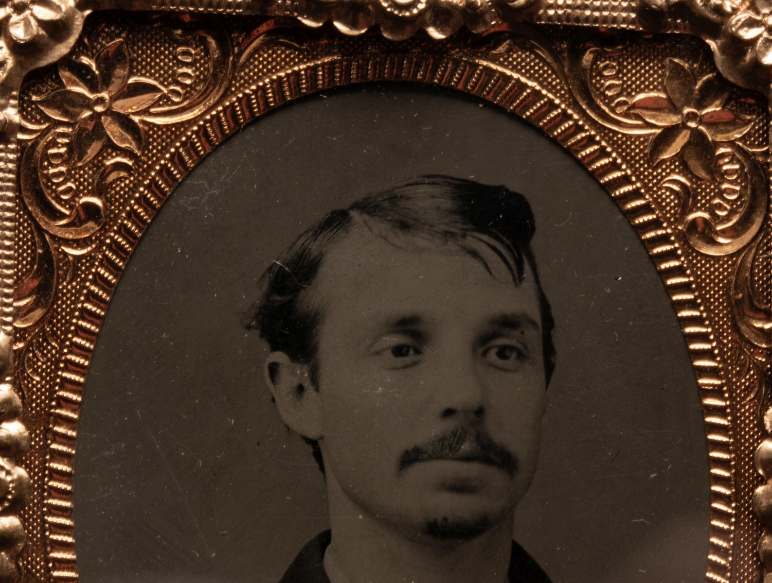 AN UNUSUAL LEATHER CASE WITH TINTYPES AND DAGUERREOTYPE