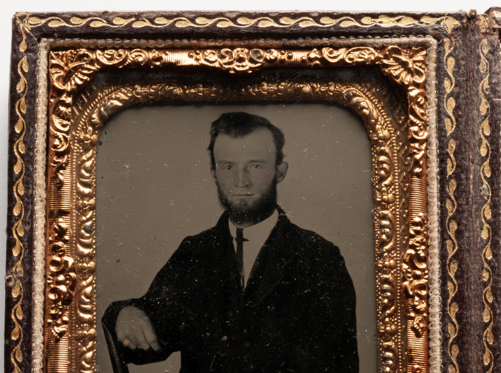 AN UNUSUAL LEATHER CASE WITH TINTYPES AND DAGUERREOTYPE