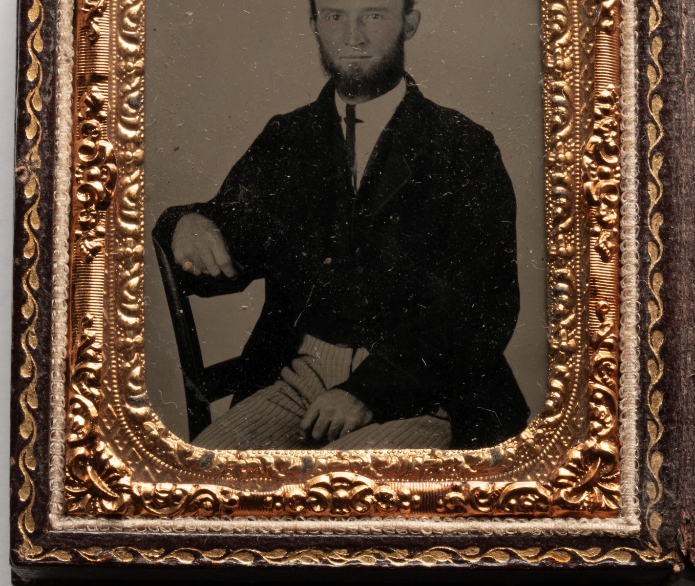 AN UNUSUAL LEATHER CASE WITH TINTYPES AND DAGUERREOTYPE