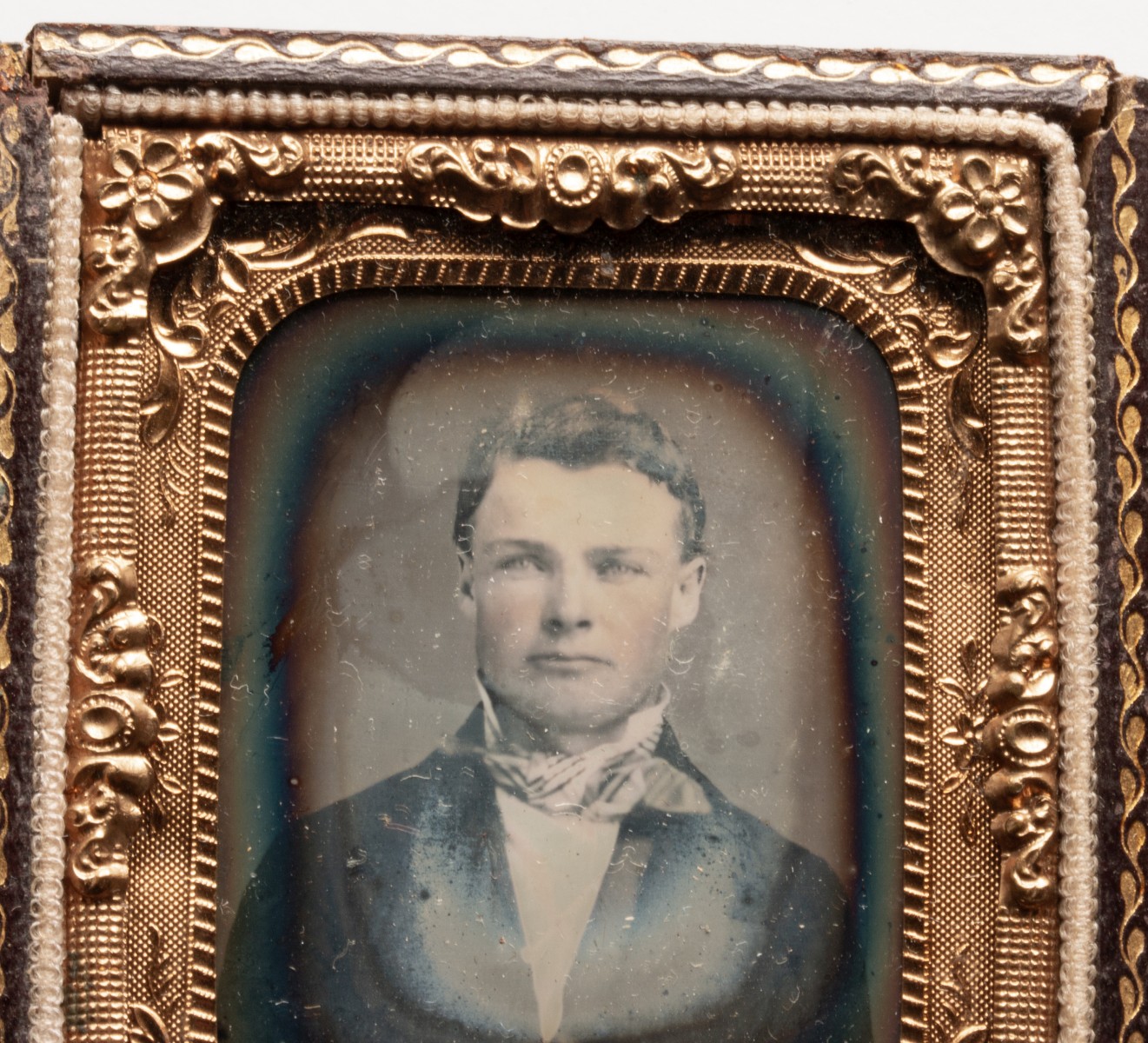 AN UNUSUAL LEATHER CASE WITH TINTYPES AND DAGUERREOTYPE