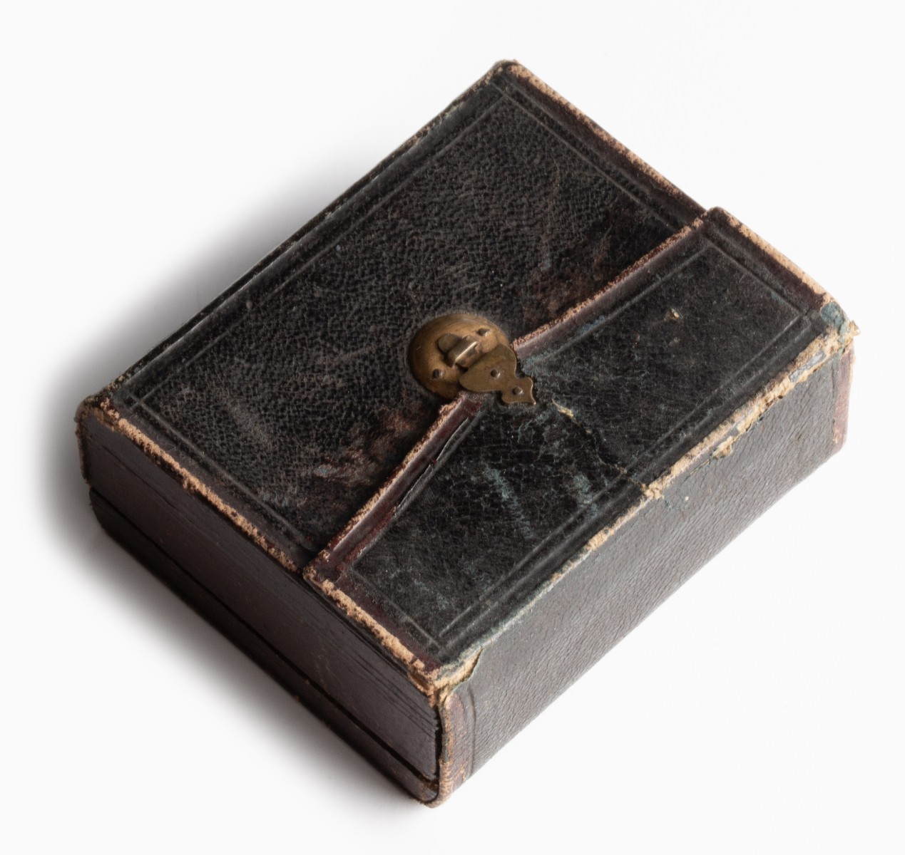 AN UNUSUAL LEATHER CASE WITH TINTYPES AND DAGUERREOTYPE