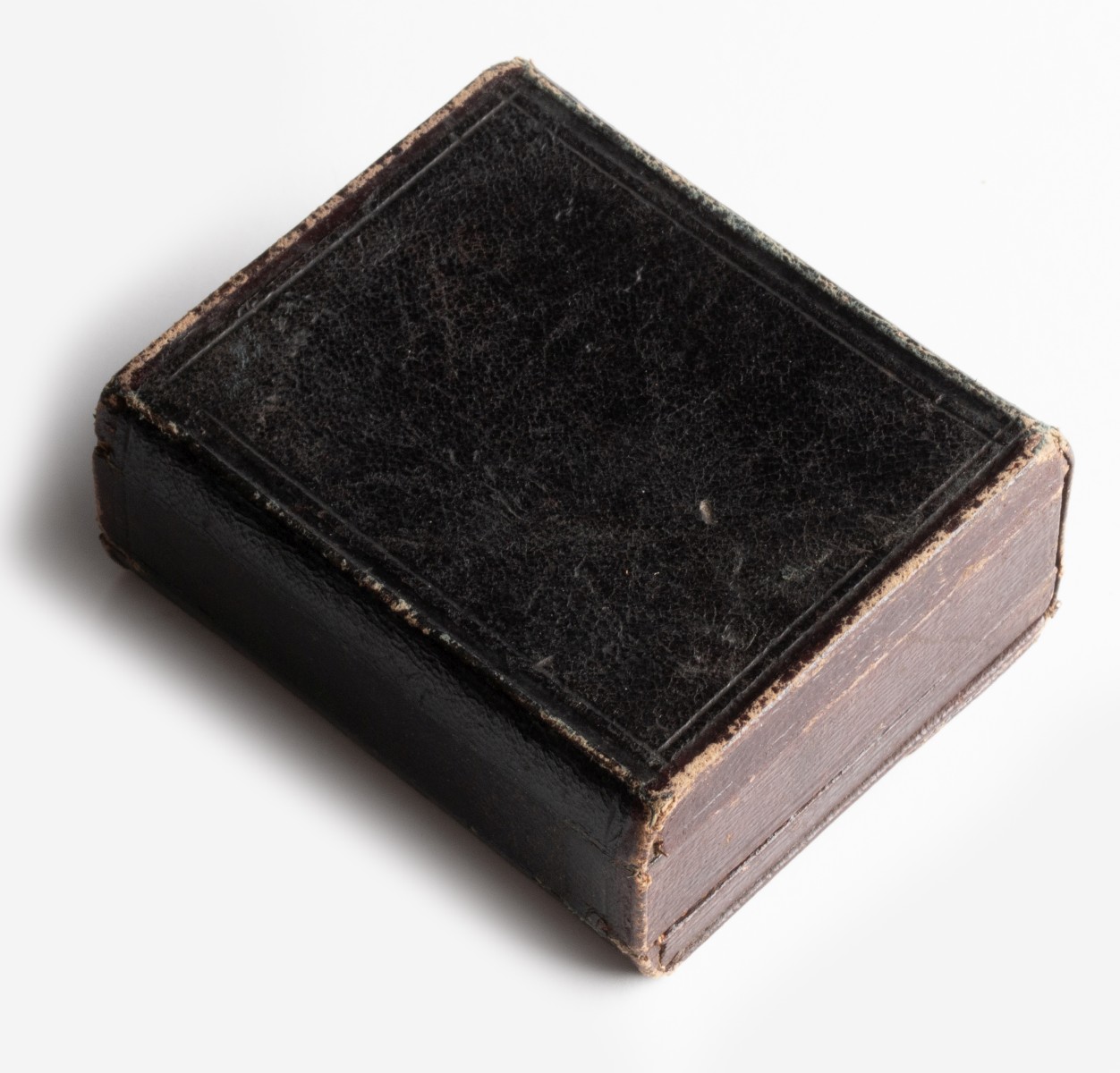 AN UNUSUAL LEATHER CASE WITH TINTYPES AND DAGUERREOTYPE