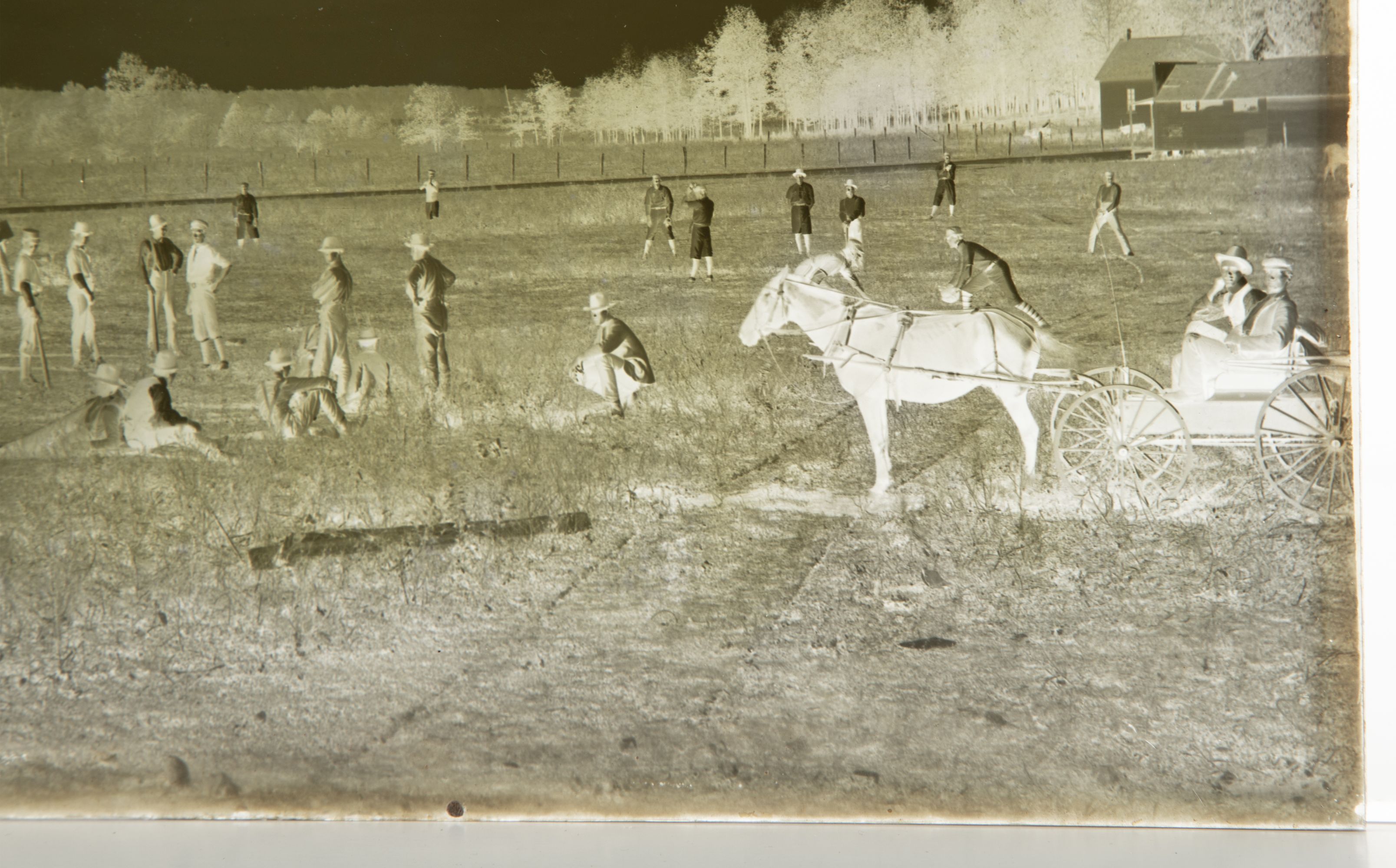 A 19C GLASS PLATE NEGATIVE PICTURING A BASEBALL GAME