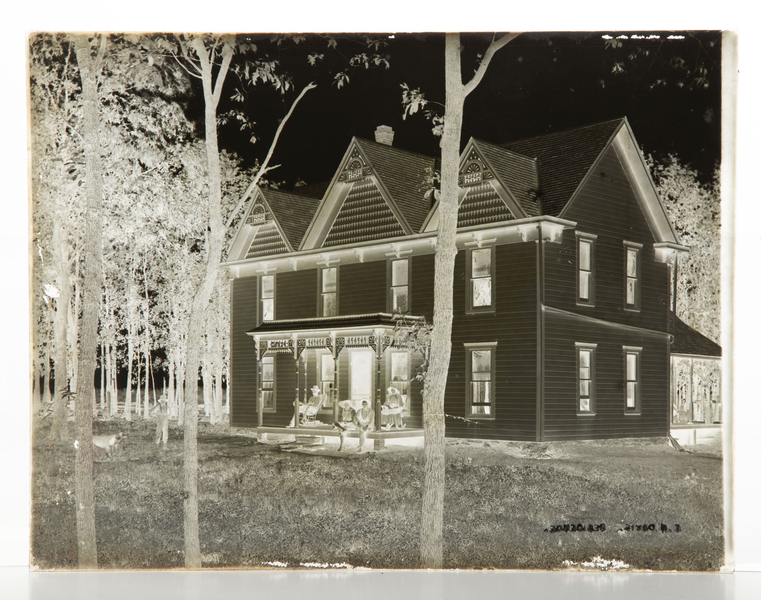 A 19C GLASS PLATE NEGATIVE PICTURING A BASEBALL GAME