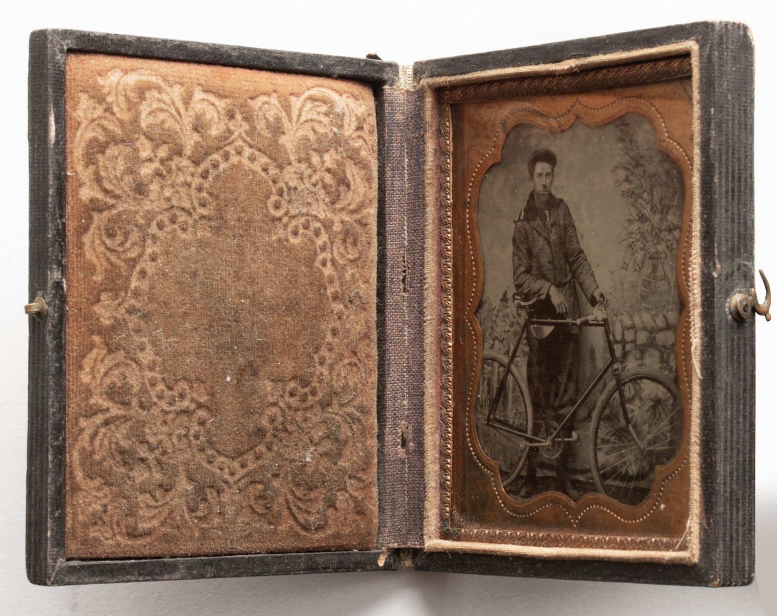 A GOOD TINTYPE PHOTOGRAPH OF GENTLEMAN WITH HIS BICYCLE