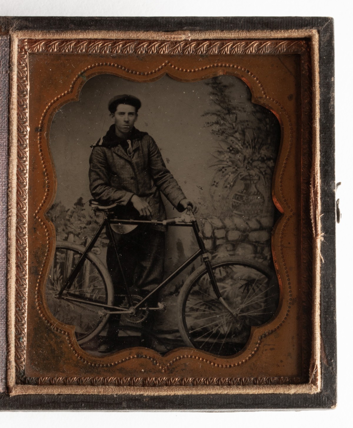 A GOOD TINTYPE PHOTOGRAPH OF GENTLEMAN WITH HIS BICYCLE