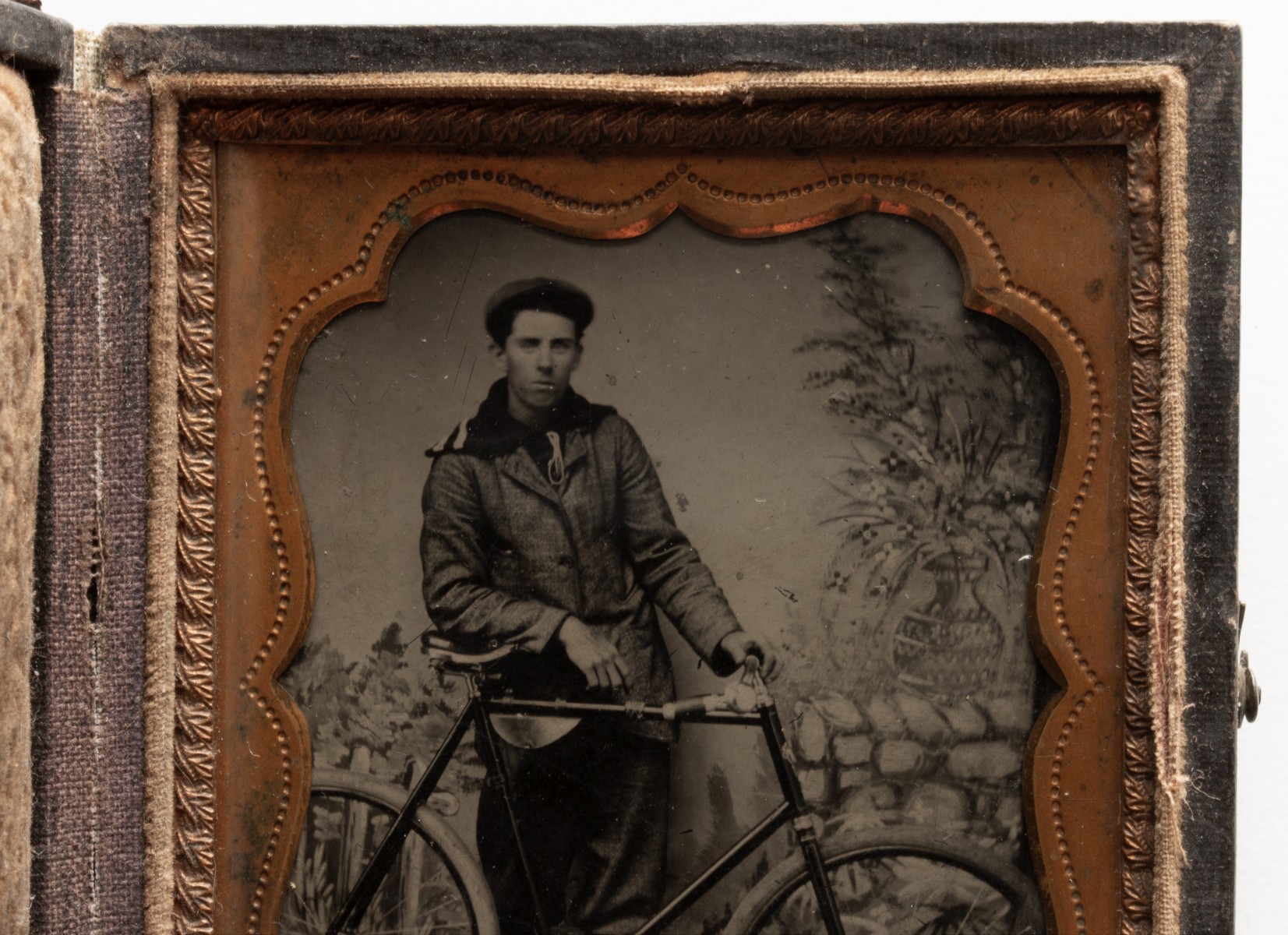 A GOOD TINTYPE PHOTOGRAPH OF GENTLEMAN WITH HIS BICYCLE