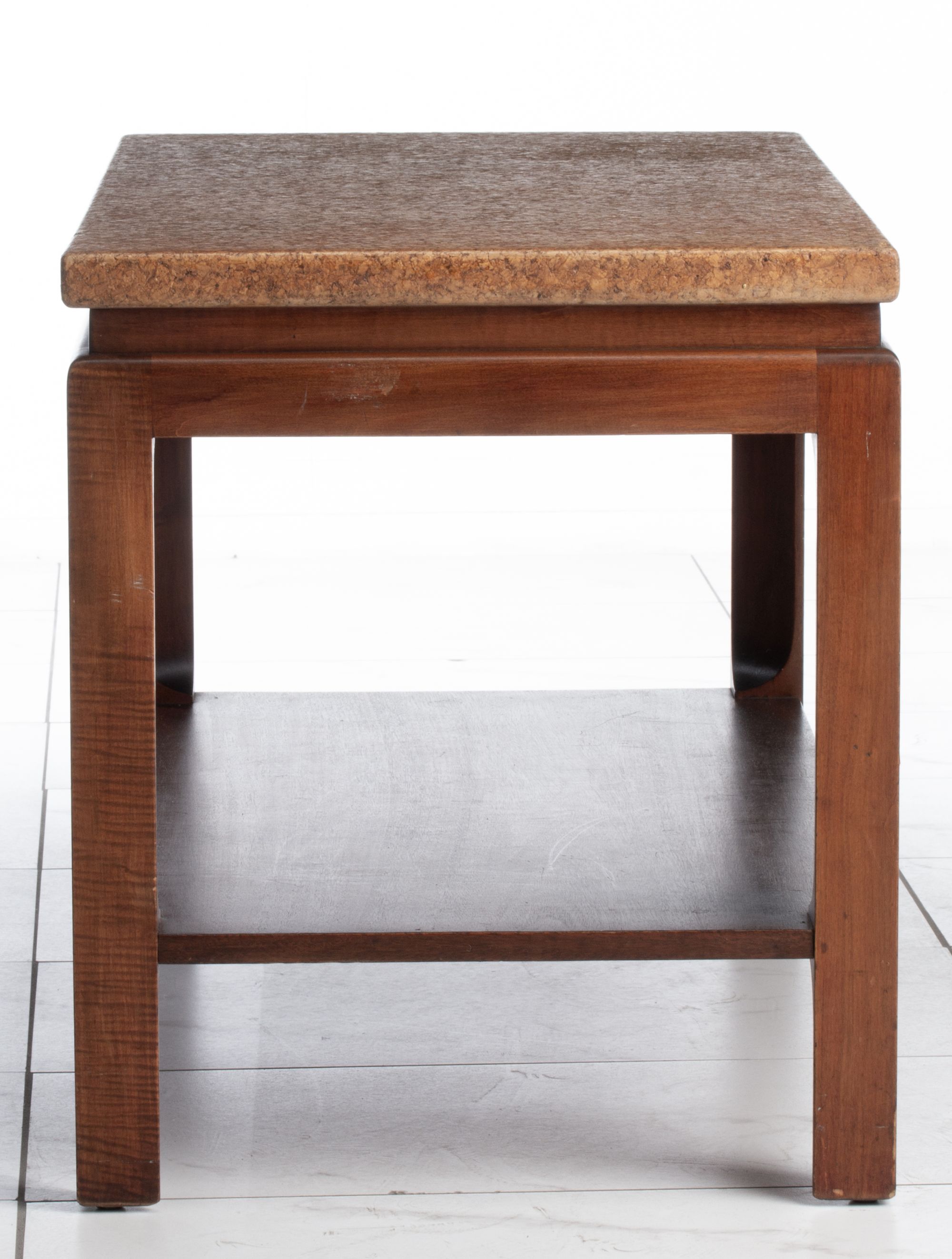 A PAUL FRANKL SIDE TABLE WITH CORK TOP