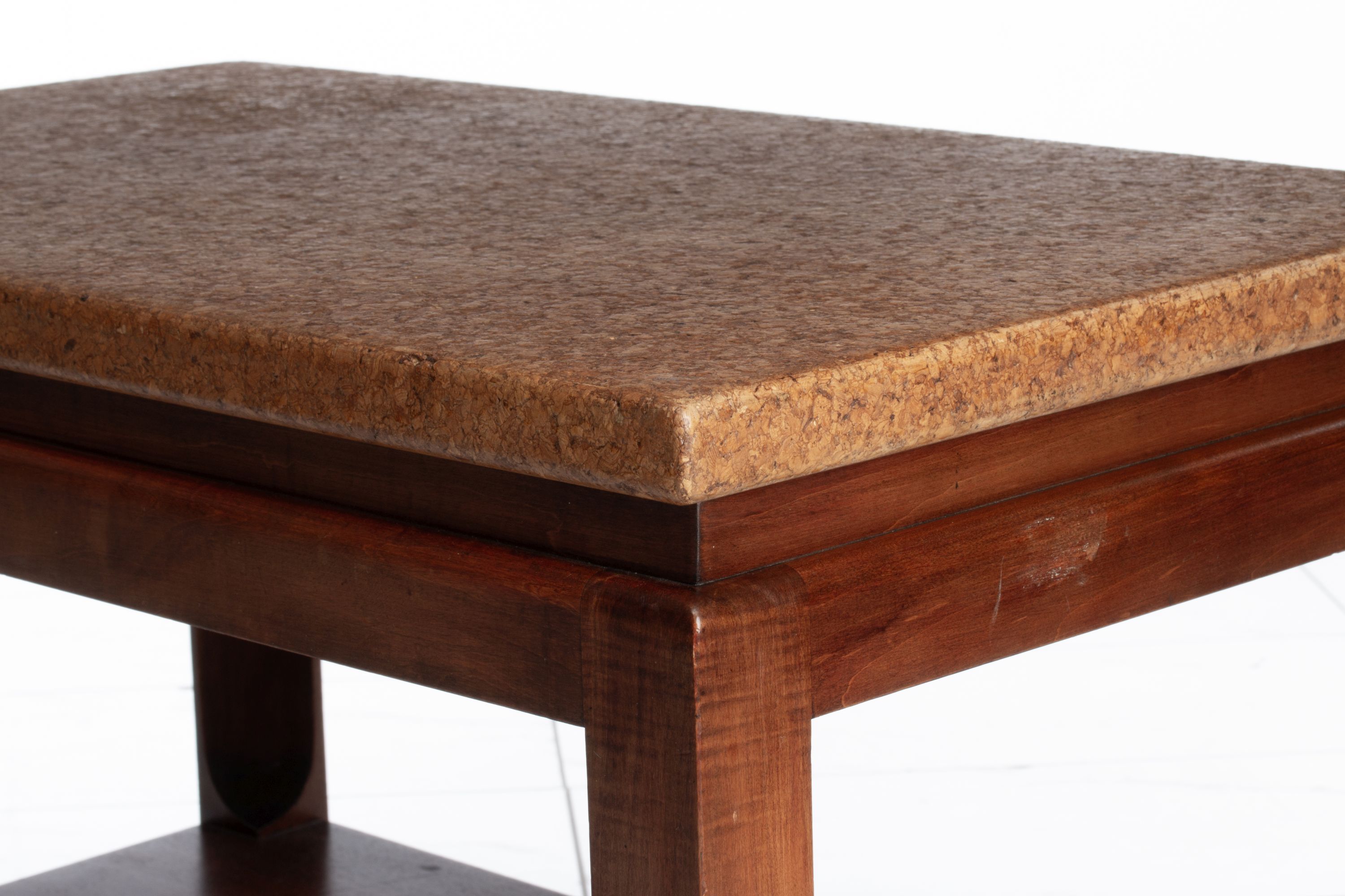 A PAUL FRANKL SIDE TABLE WITH CORK TOP