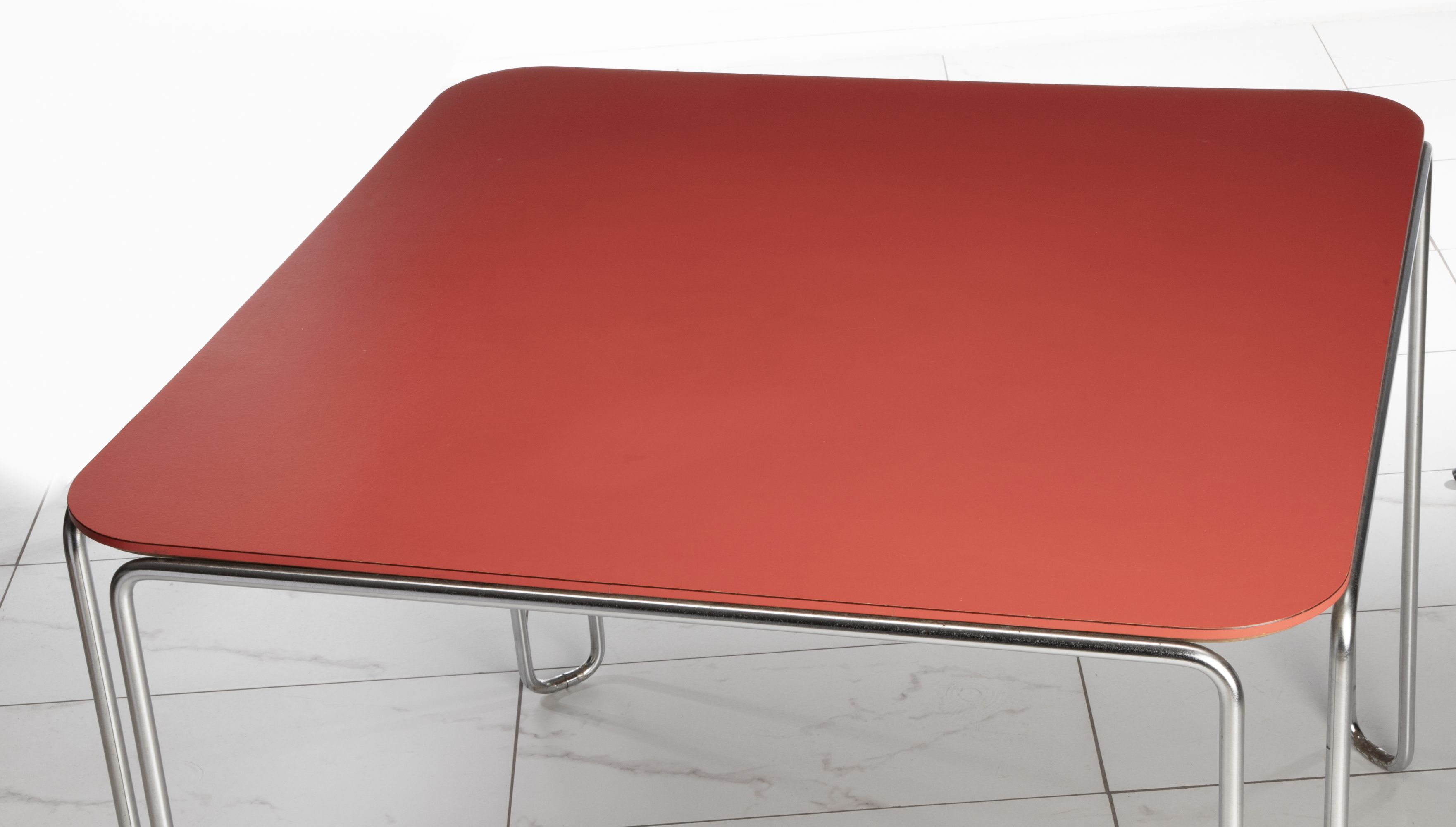 A SCARCE MARCEL BREUER MODEL B10 TABLE WITH RED TOP