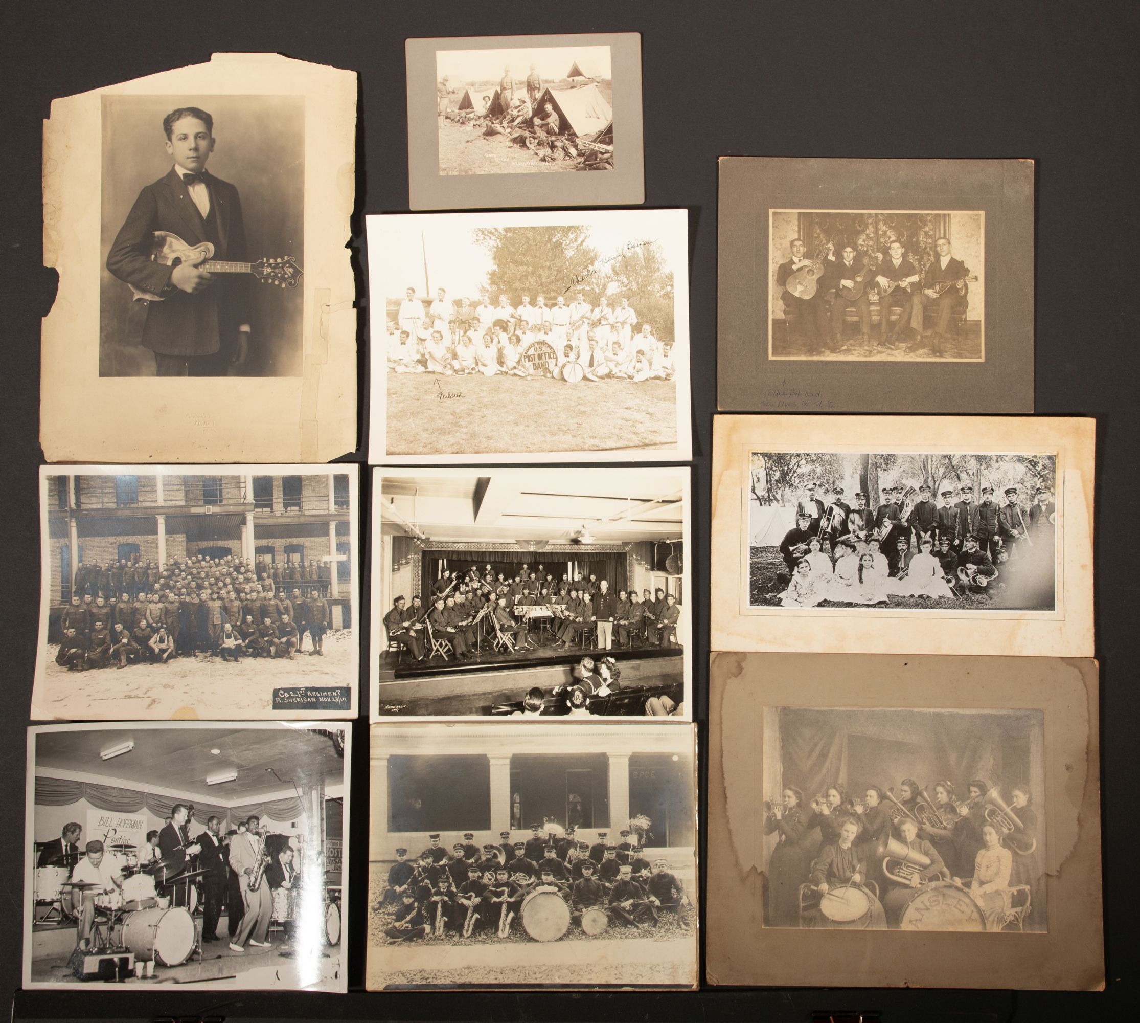 A COLLECTION OF MOUNTED PHOTOGRAPHS INCLUDING MUSICIANS