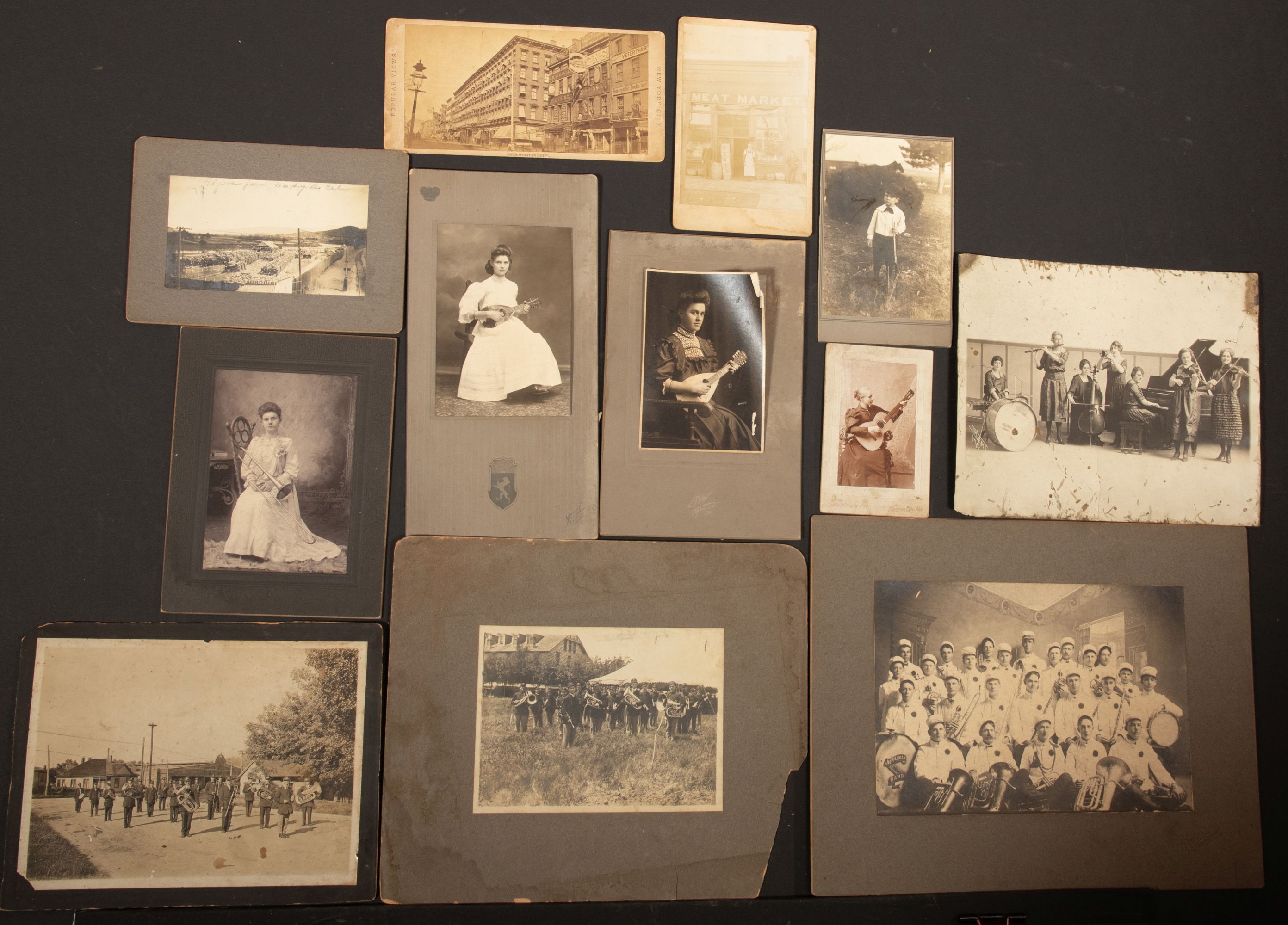 A COLLECTION OF MOUNTED PHOTOGRAPHS INCLUDING MUSICIANS