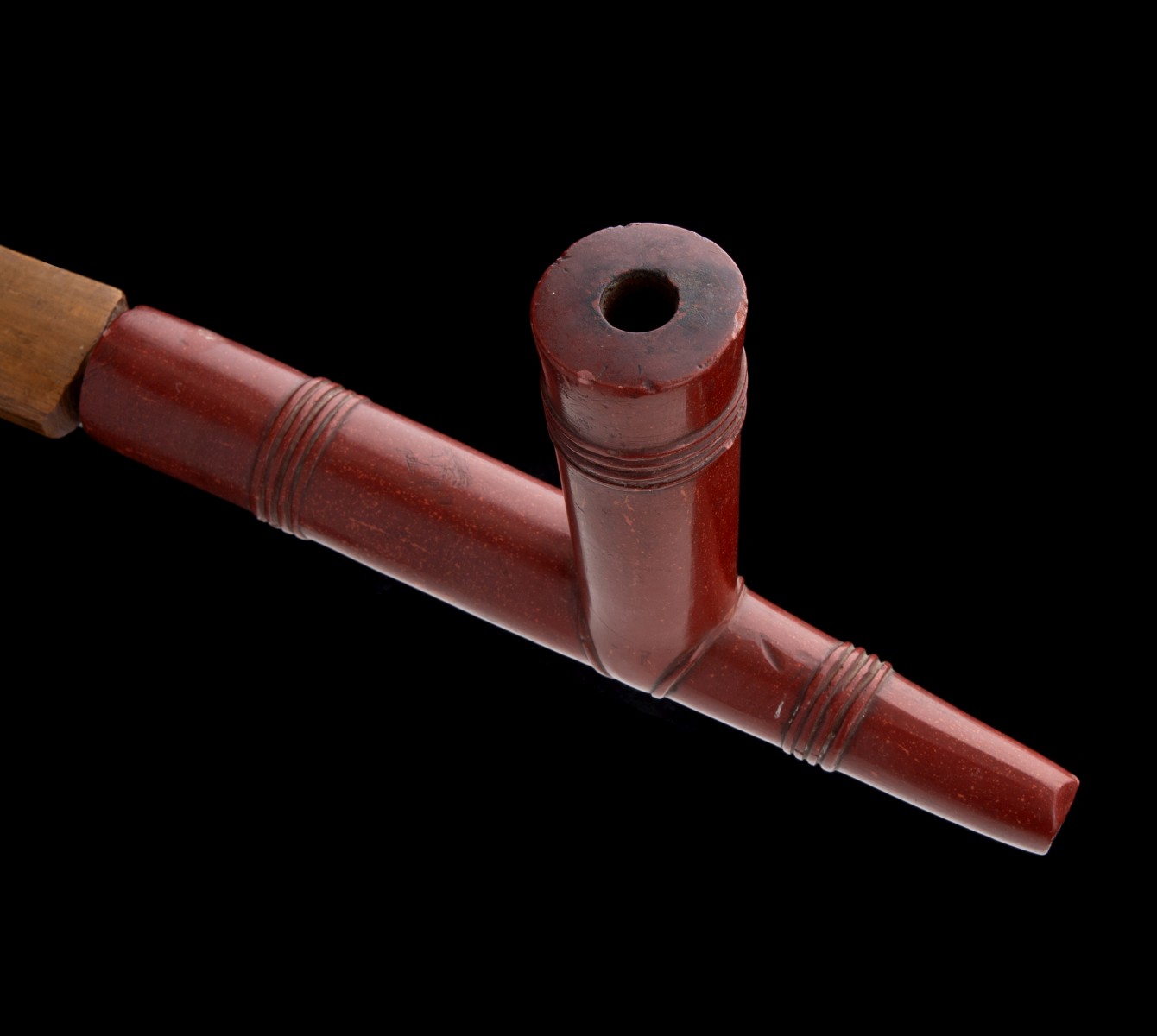 A LAKOTA CATLINITE PIPE WITH QUILLWORK STEM