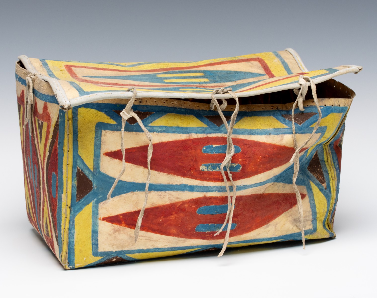 A LAKOTA PARFLECHE LIDDED BOX 1900-1910