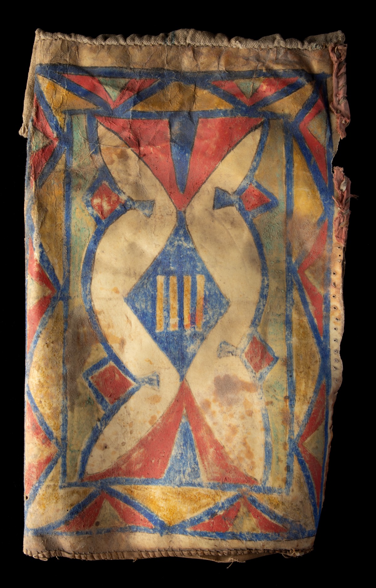 AN 1870s PARFLECHE ELLIPTICAL CASE WITH CANVAS TOP