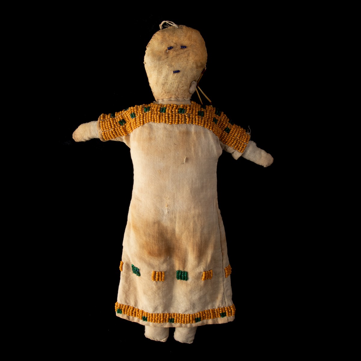 A MUSLIN AND NATIVE TANNED PLAINS INDIAN DOLL C. 1875