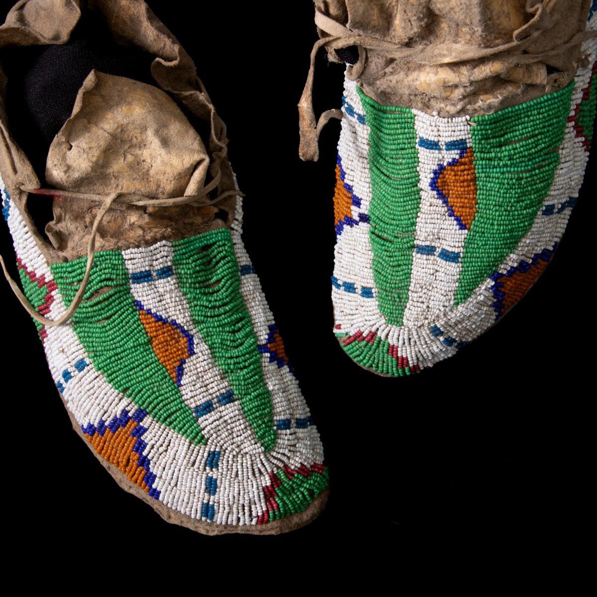 A PAIR OF LAKOTA BEADED MOCCASINS CIRCA 1890