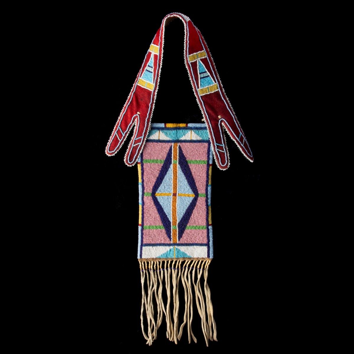 A CROW BEADED AND FRINGED HIDE MIRROR BAG CIRCA 1900