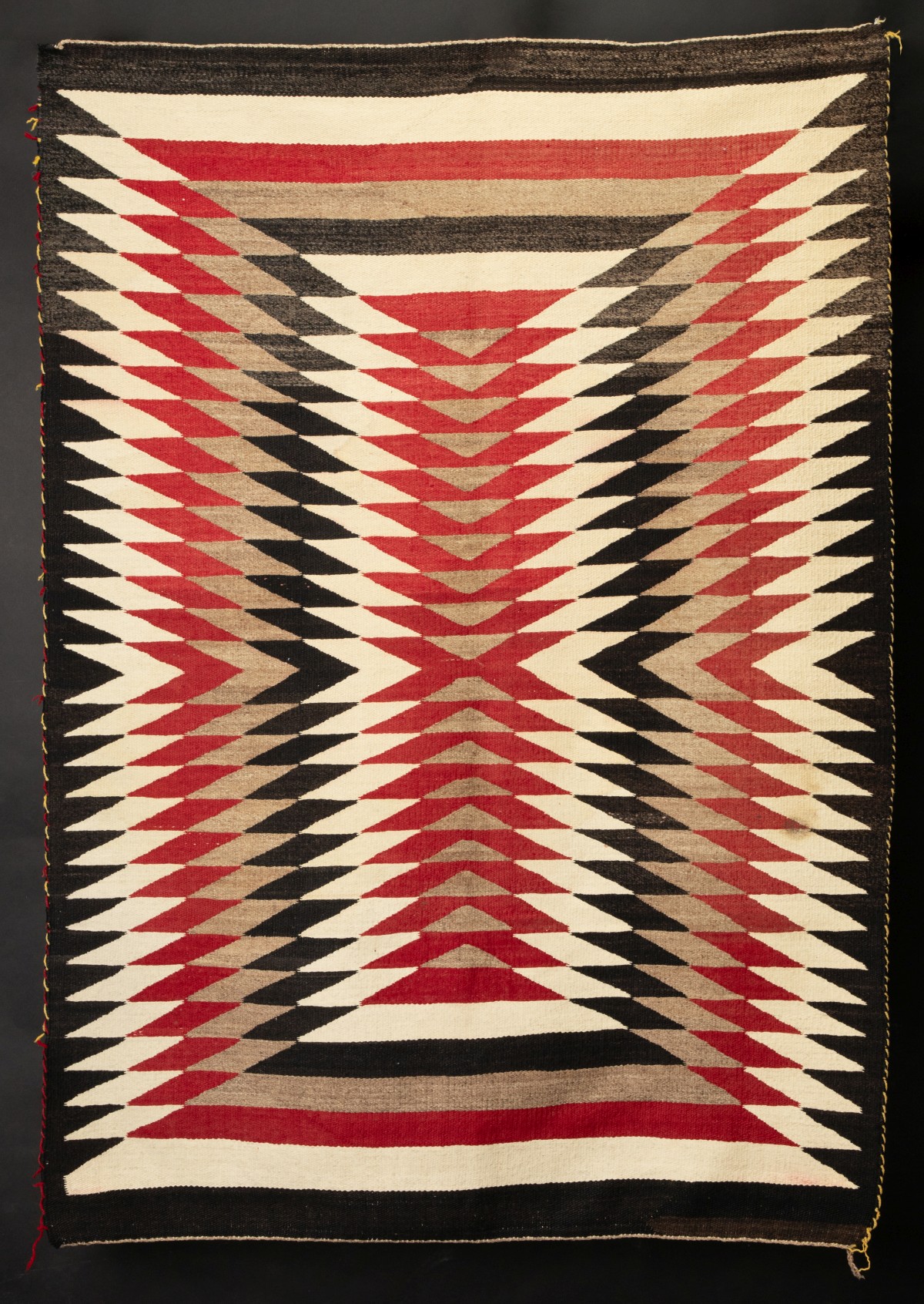 A HIGHLY OPTIC EYE DAZZLER TYPE NAVAJO GANADO RUG